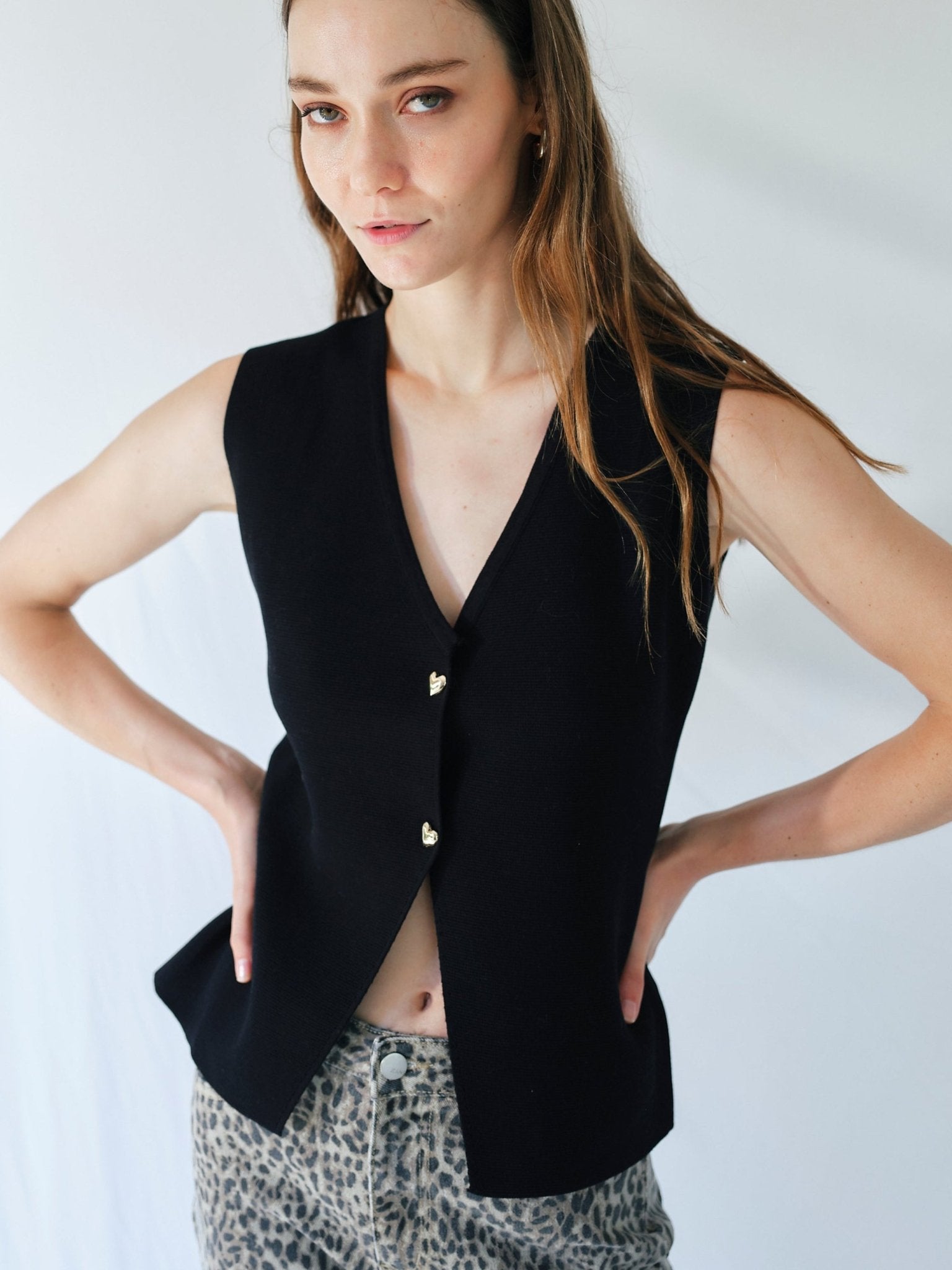 View our Sleeveless Knitted Cardi with Gold Heart Buttons in Black - by Tribute Store