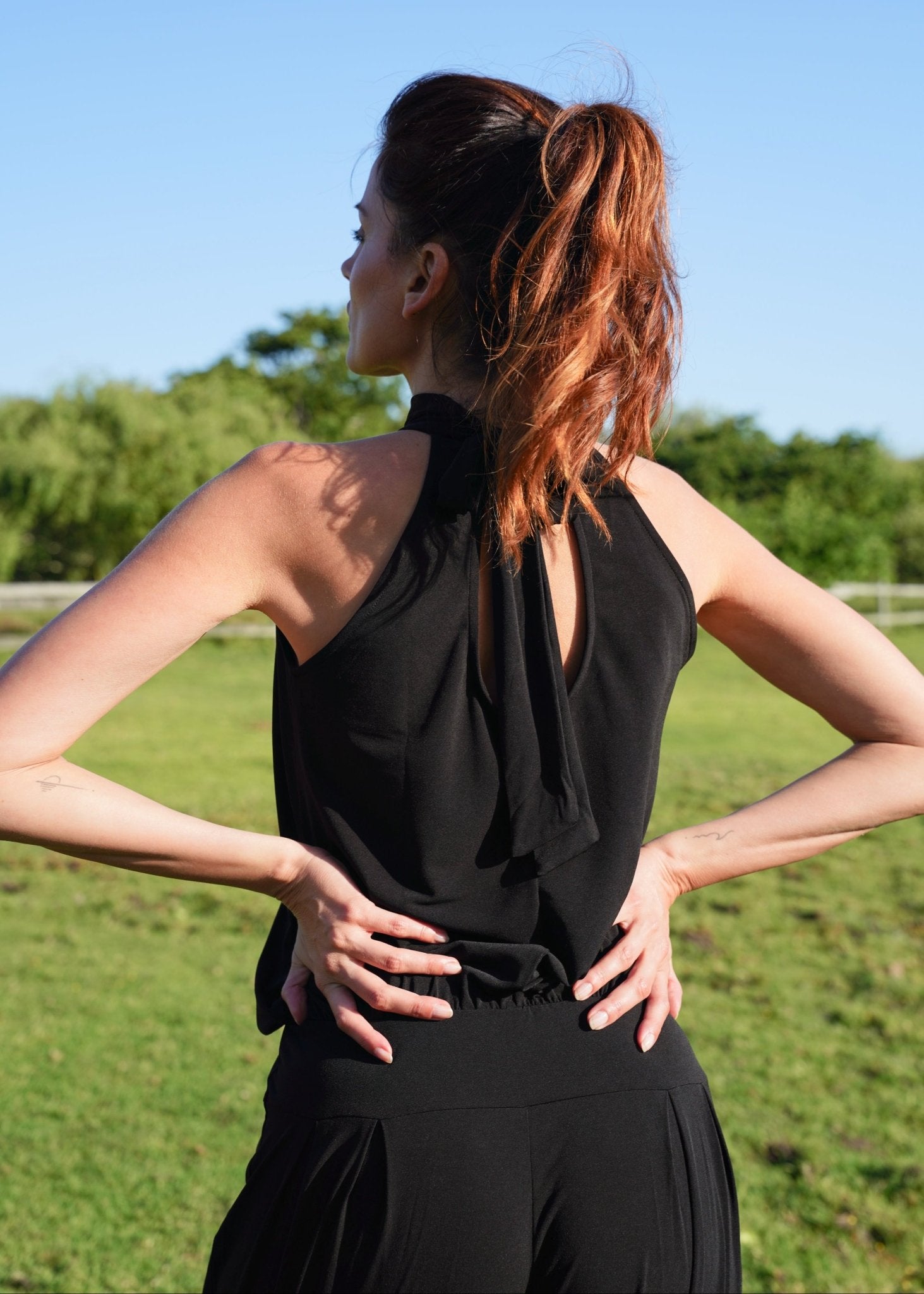 View our Zarah Halterneck Jumpsuit in Black - by Tribute Store