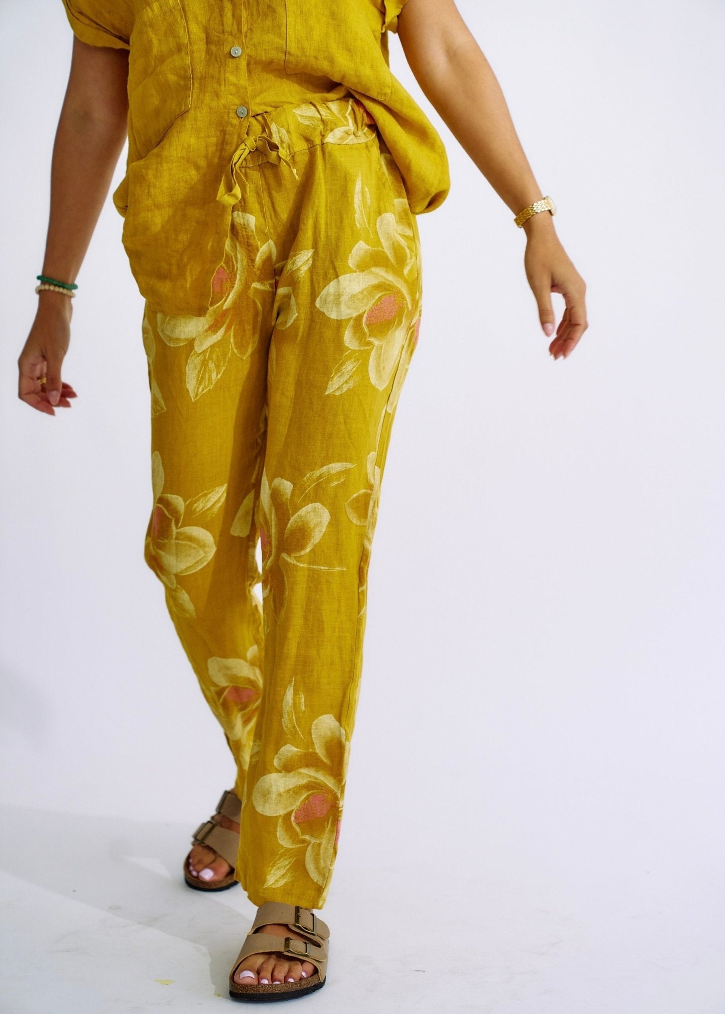 View our Pure Linen Italian Floral Printed Joggers Deep Yellow - The ultimate BOTTOMS created by TRIBUTE and sold here, at Tribute Store