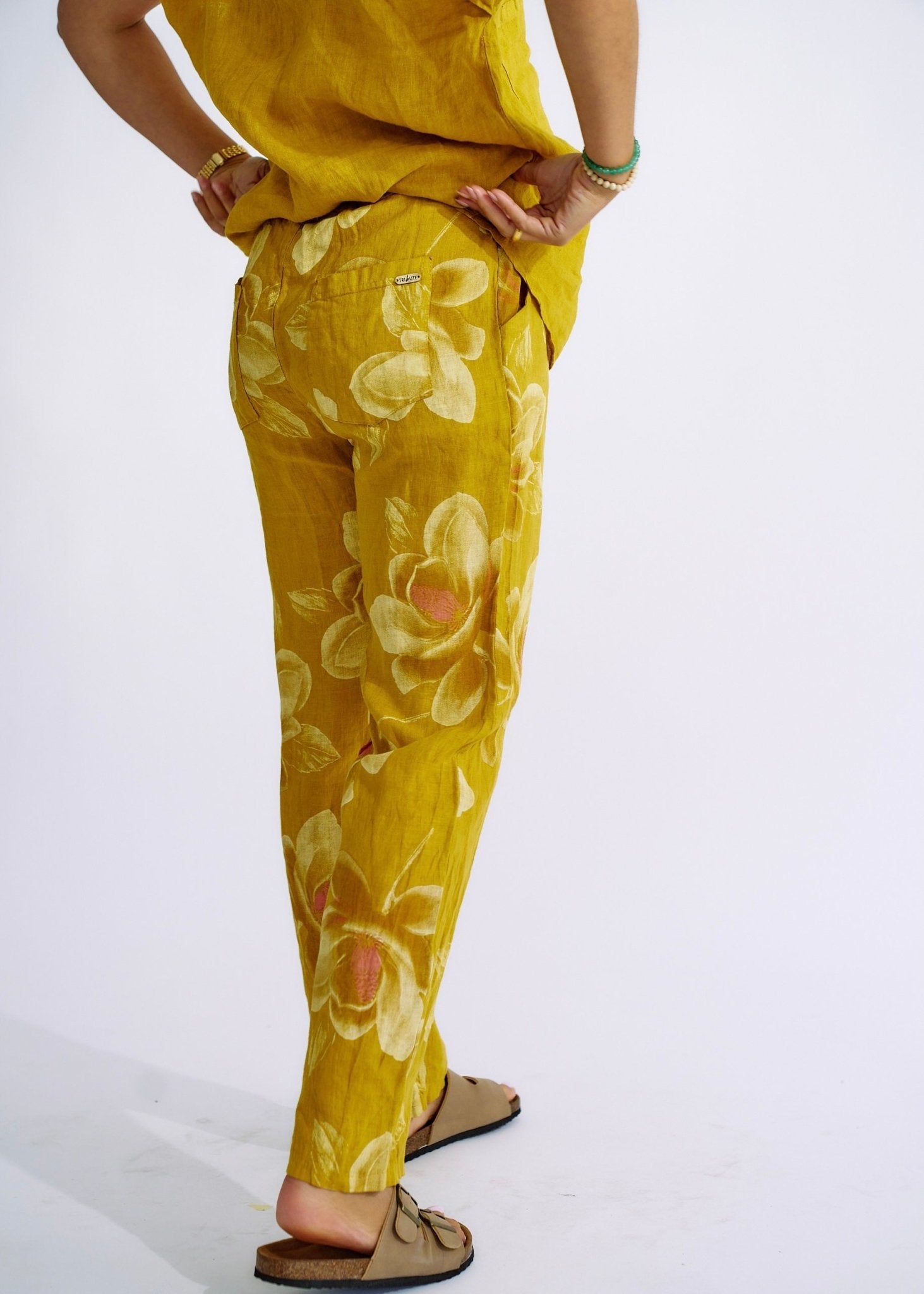 View our Pure Linen Italian Floral Printed Joggers Deep Yellow - The ultimate BOTTOMS created by TRIBUTE and sold here, at Tribute Store