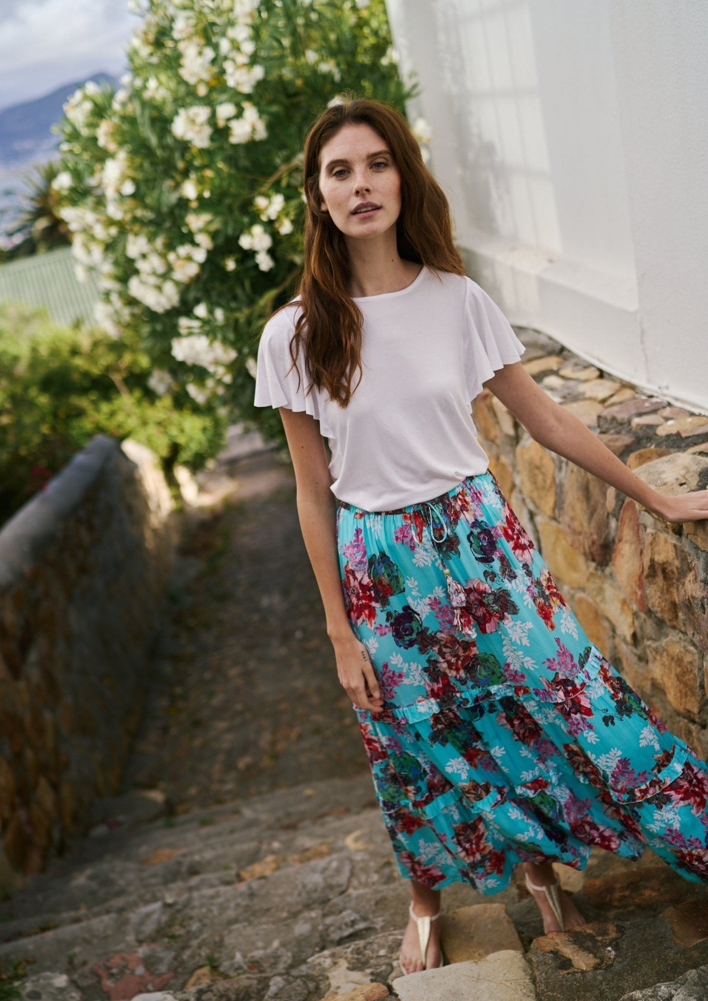 View our Flared Bohemian Tiered Skirt in Turquoise Floral Print - by Tribute Store