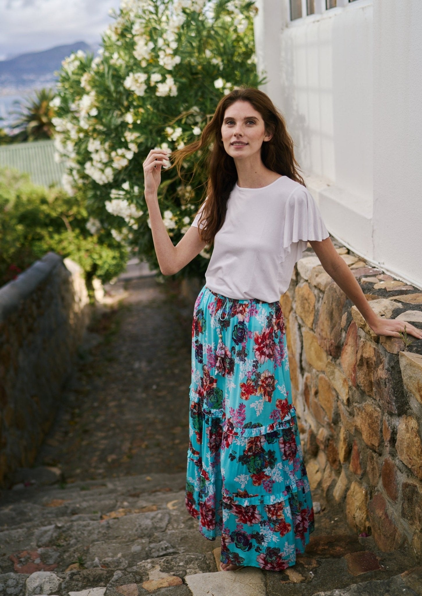 View our Flared Bohemian Tiered Skirt in Turquoise Floral Print - by Tribute Store