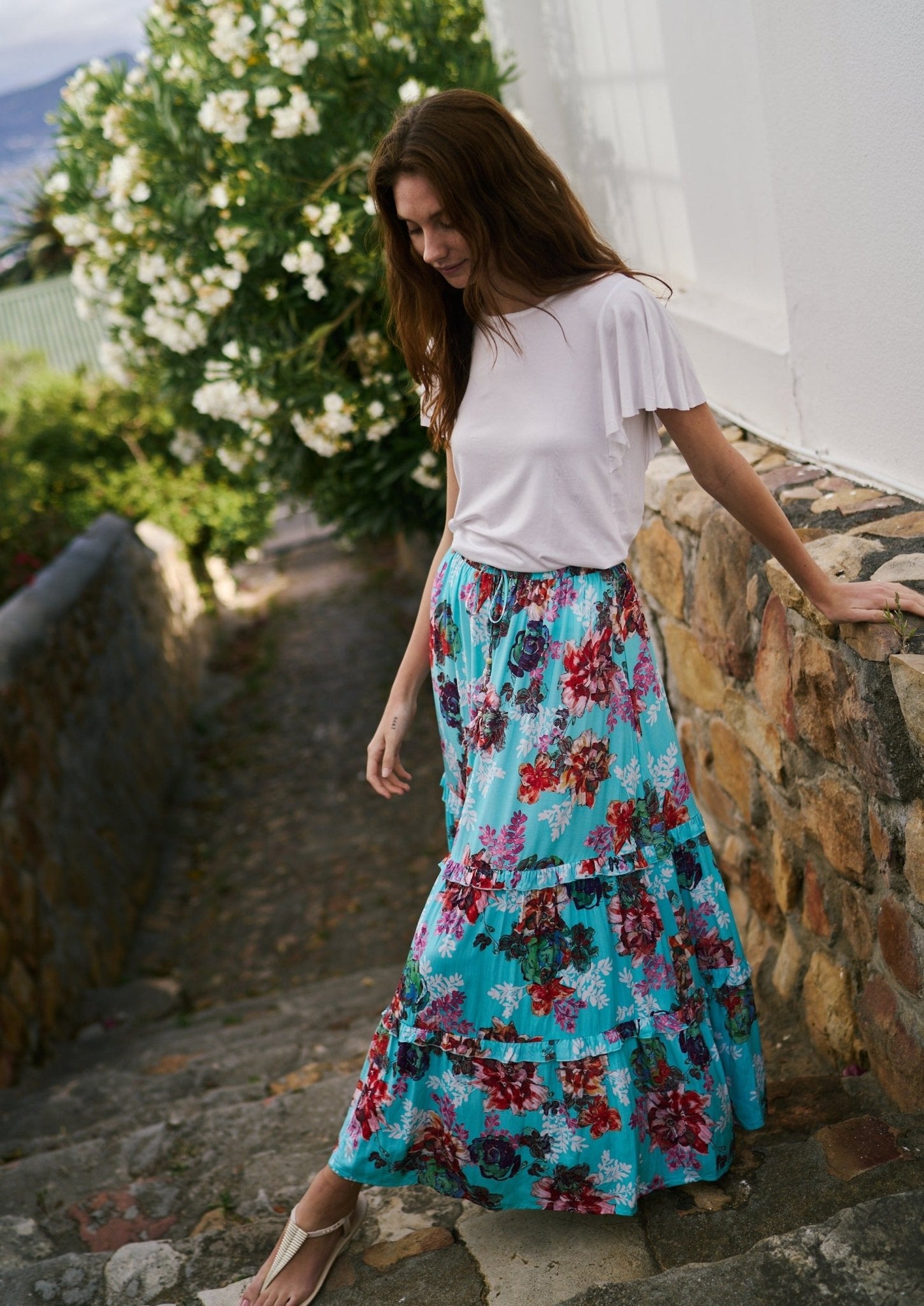 View our Flared Bohemian Tiered Skirt in Turquoise Floral Print - by Tribute Store
