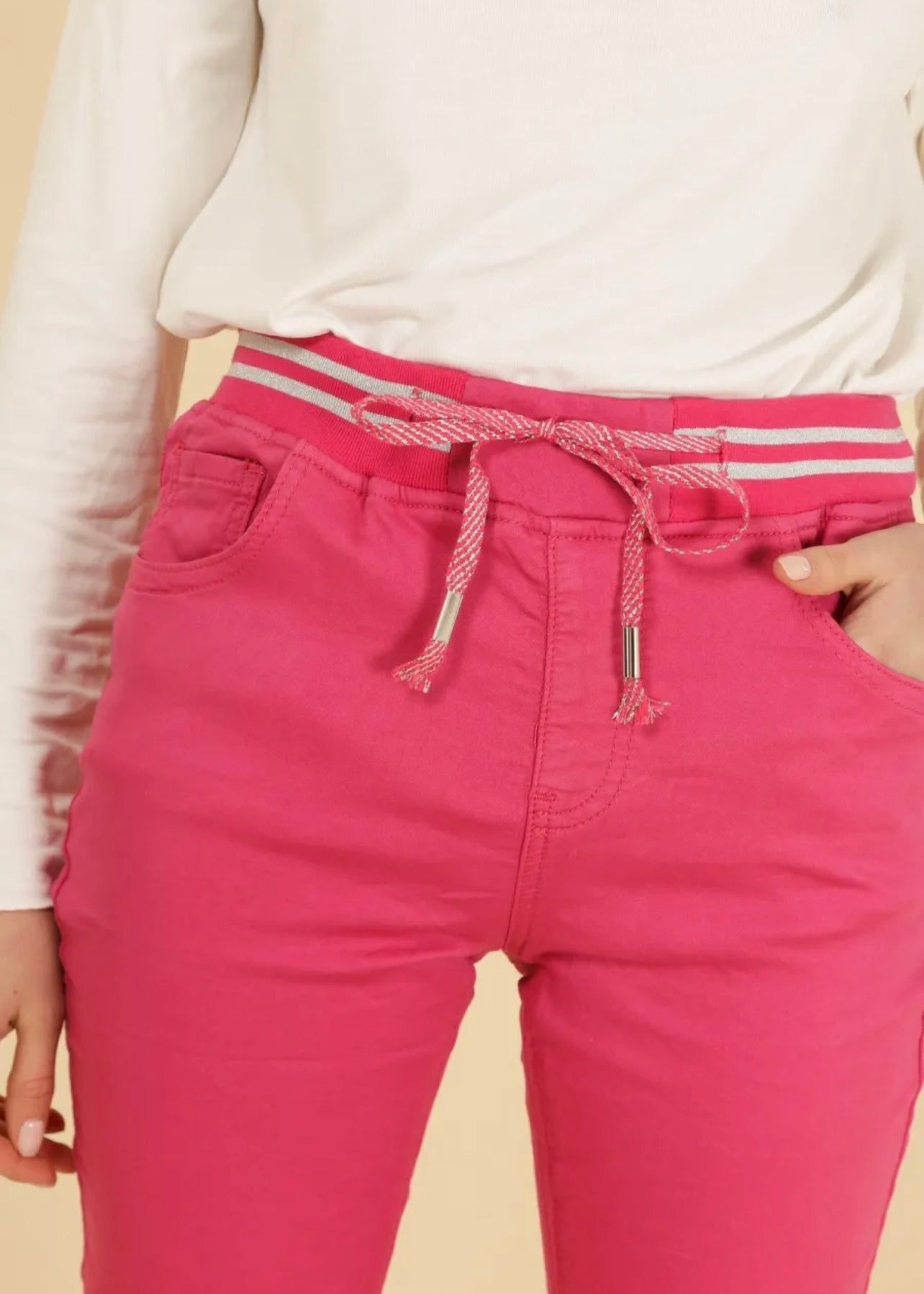 View our Mid - Rise Cotton Jogger Jeans in Fuchsia - The ultimate BOTTOMS created by TRIBUTE and sold here, at Tribute Store