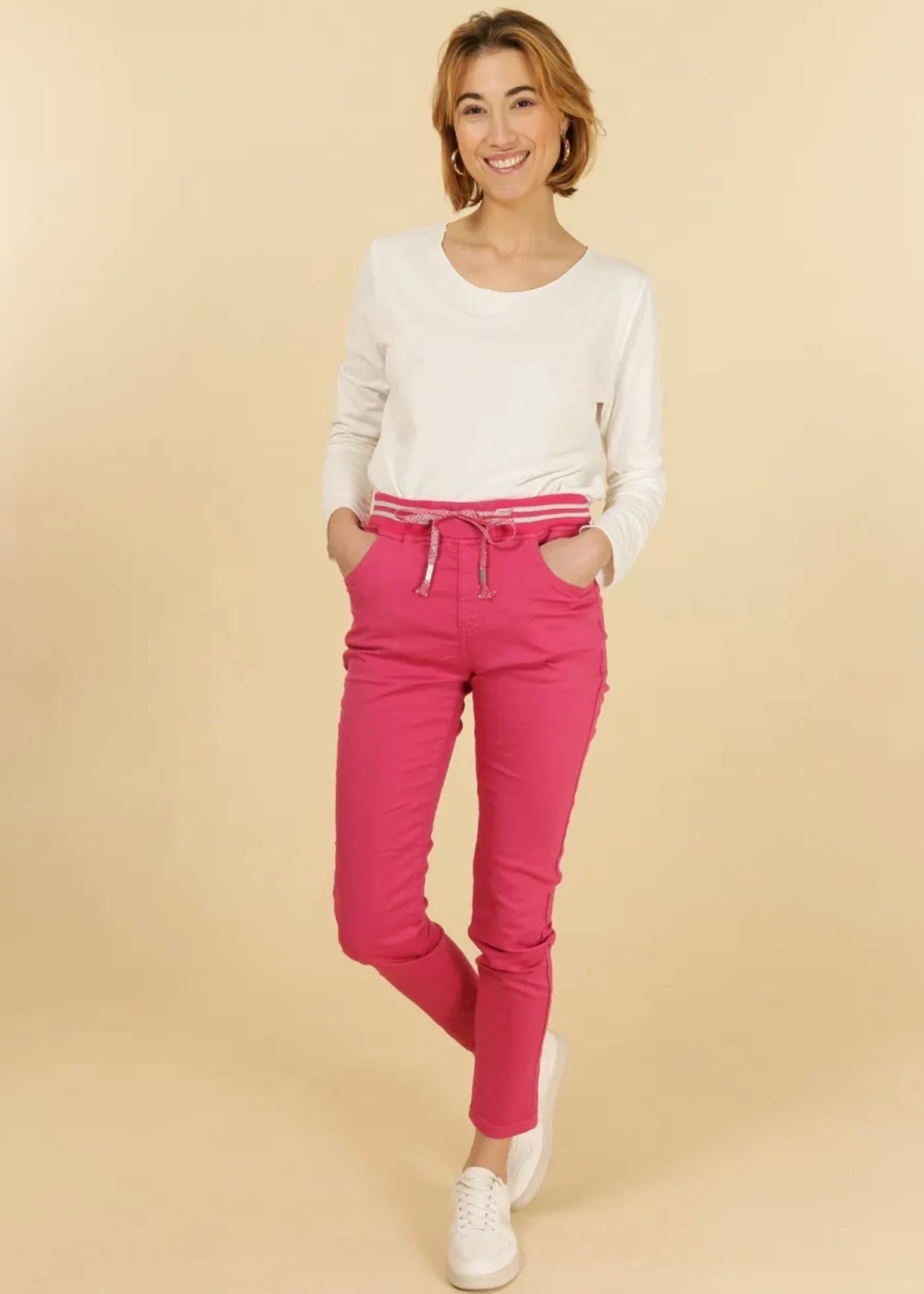 View our Mid - Rise Cotton Jogger Jeans in Fuchsia - The ultimate BOTTOMS created by TRIBUTE and sold here, at Tribute Store