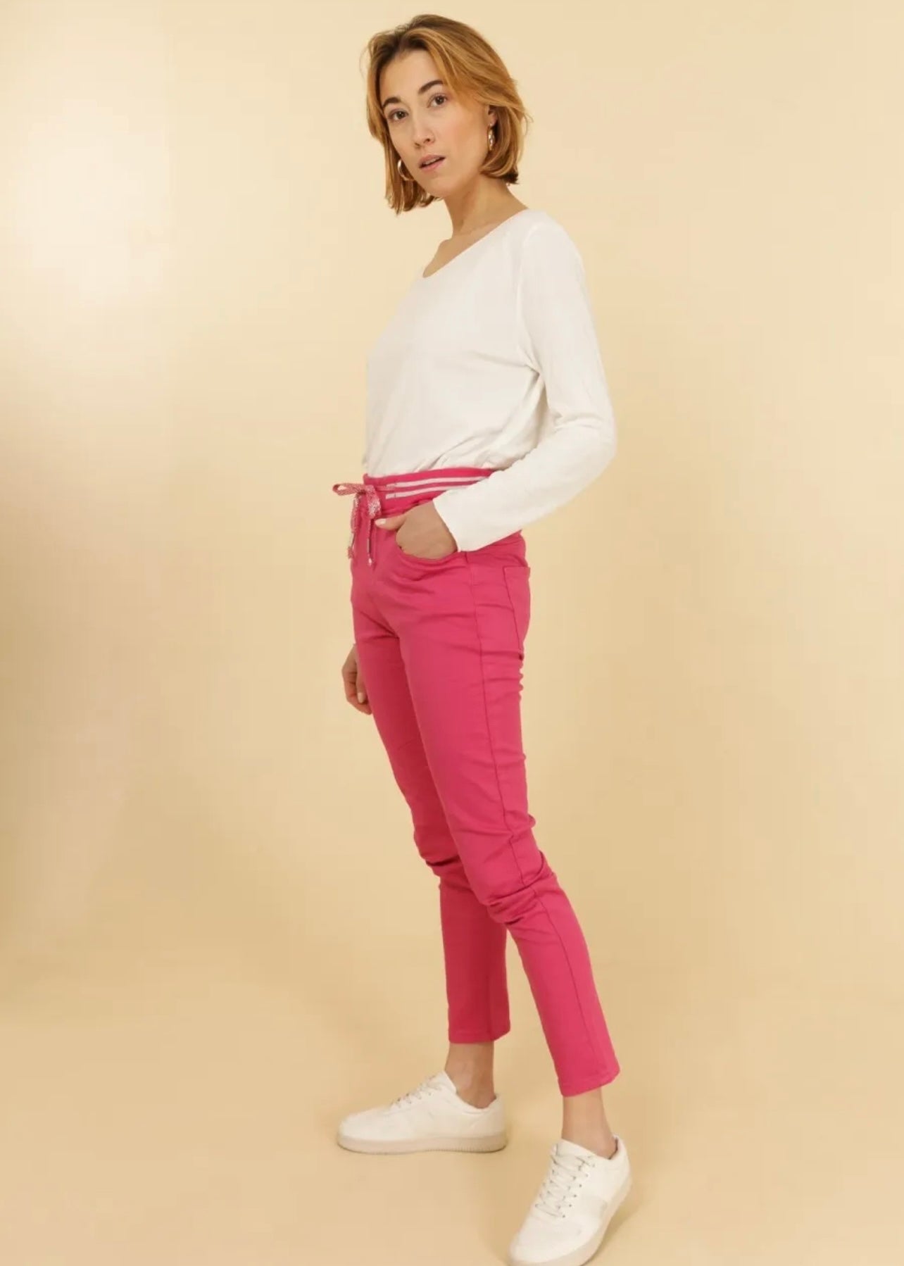 View our Mid - Rise Cotton Jogger Jeans in Fuchsia - The ultimate BOTTOMS created by TRIBUTE and sold here, at Tribute Store