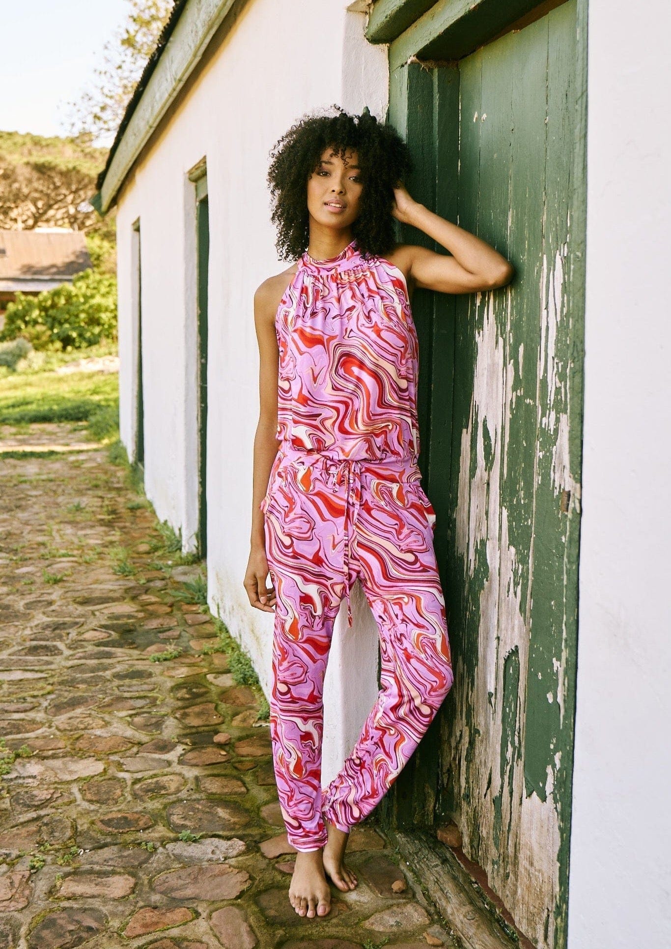 View our Purple Swirl Halter Neck Jumpsuit With Narrow Leg - The ultimate JUMPSUITS created by ICONIC and sold here, at Tribute Store
