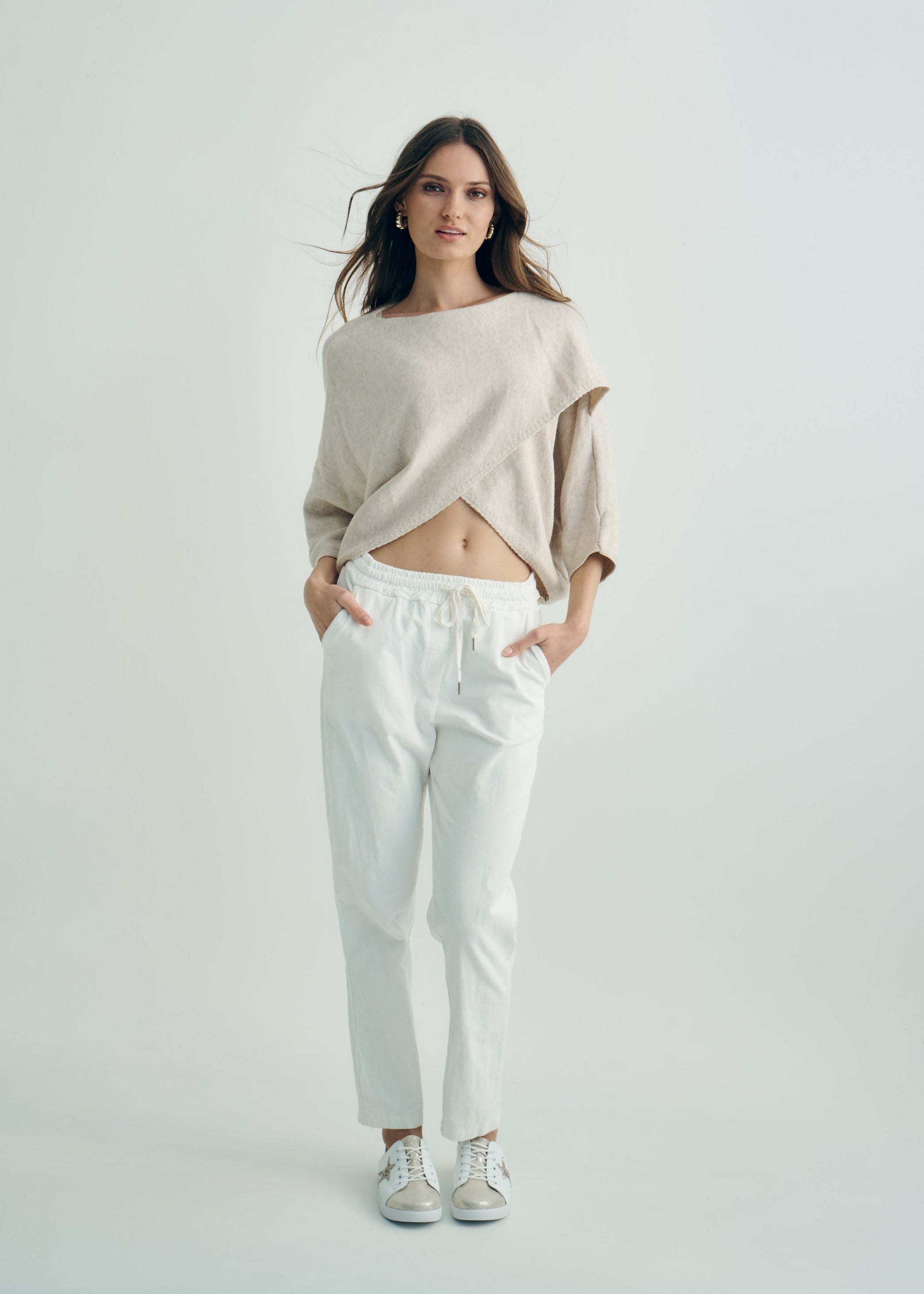 Hygge Italian Viscose Criss Cross Batwing Sleeve Knit In Beige