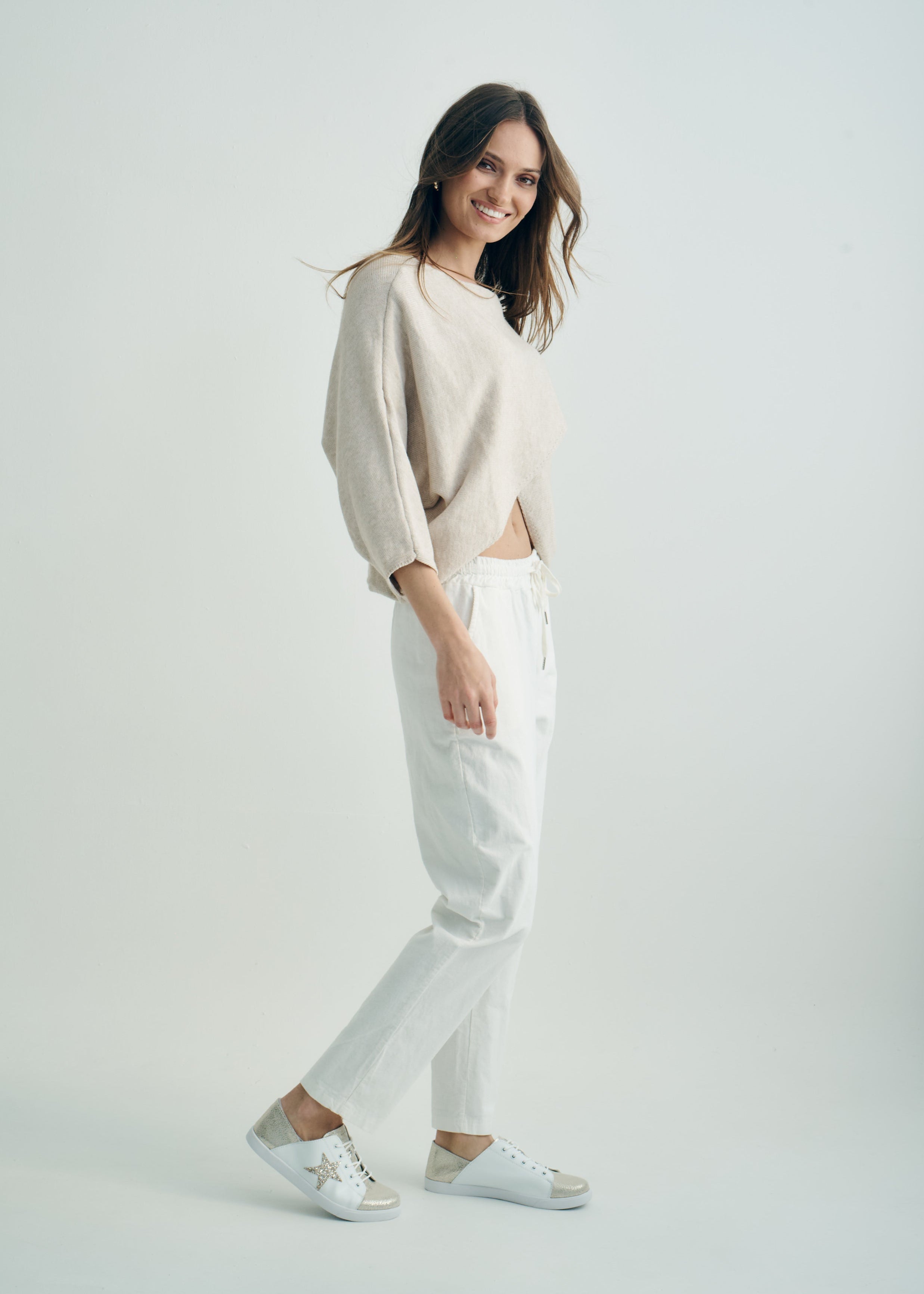 Hygge Italian Viscose Criss Cross Batwing Sleeve Knit In Beige