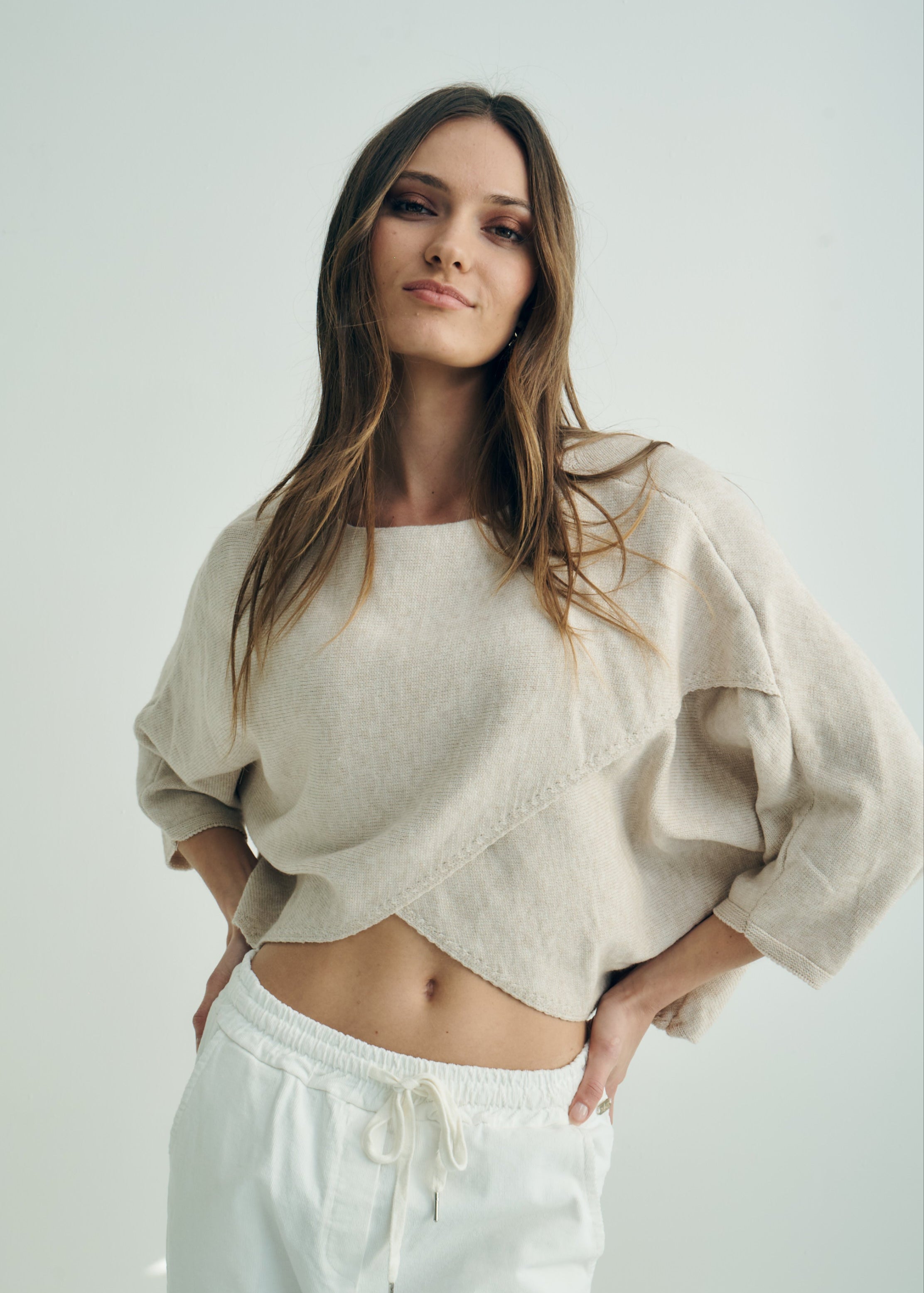 Hygge Italian Viscose Criss Cross Batwing Sleeve Knit In Beige