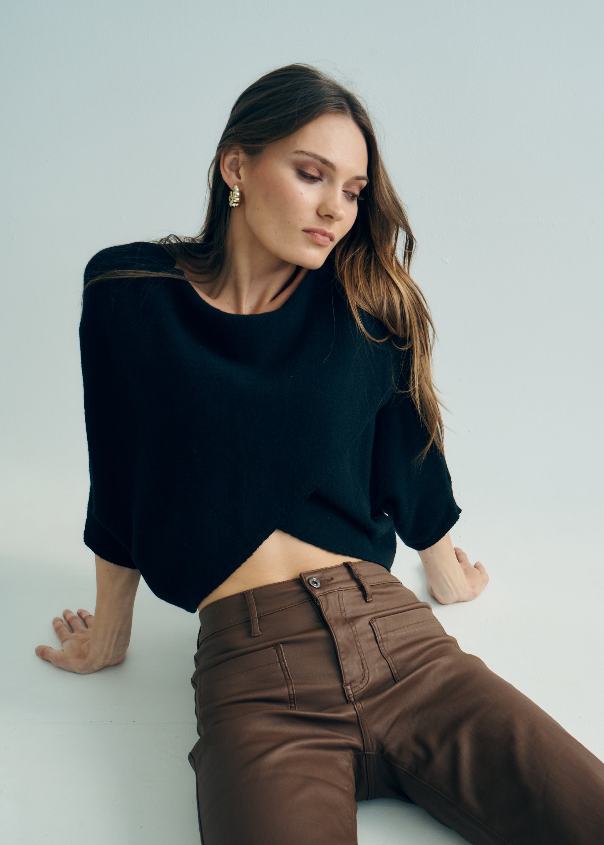 Hygge Italian Viscose Criss Cross Batwing Sleeve Knit In Black