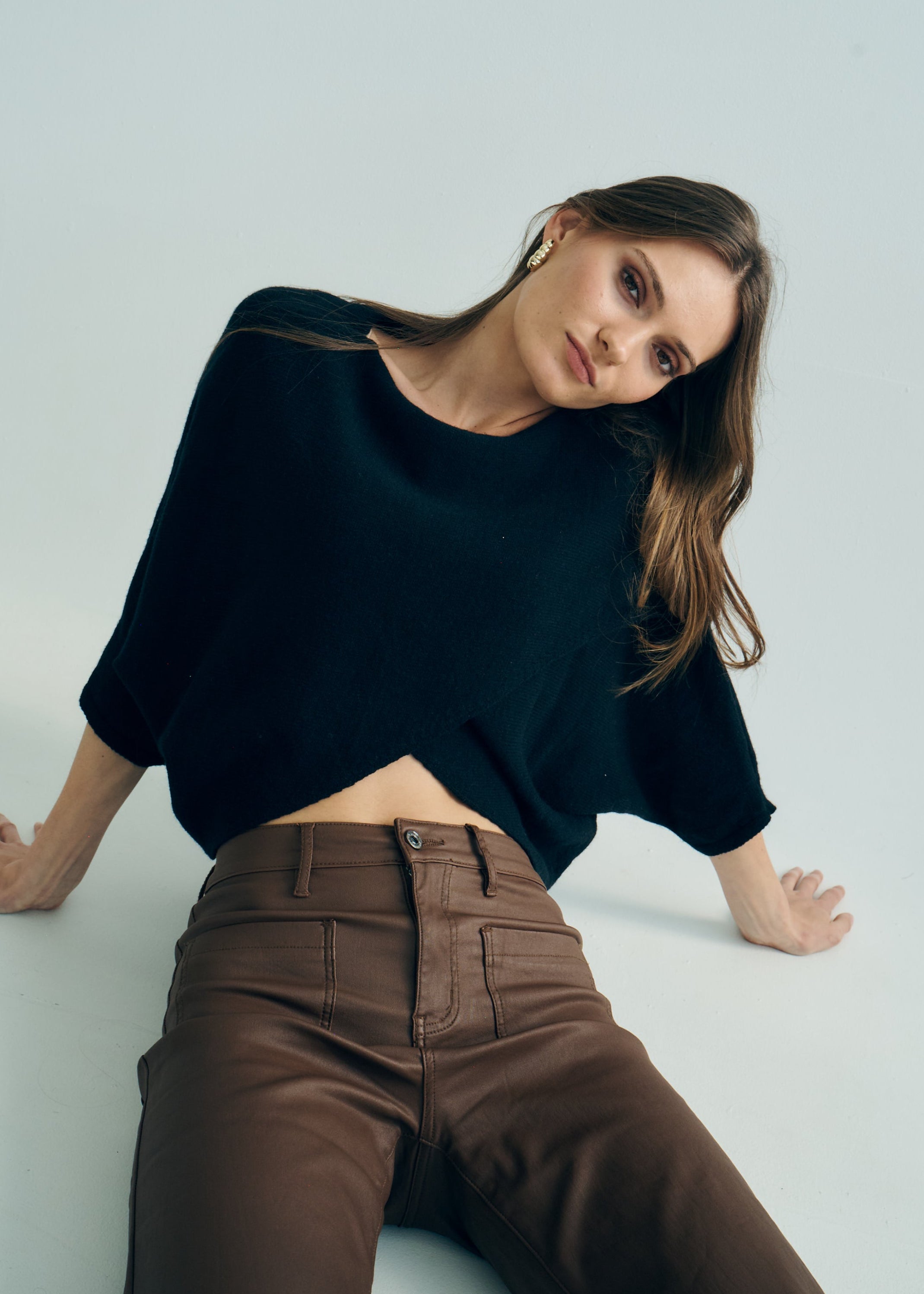 Hygge Italian Viscose Criss Cross Batwing Sleeve Knit In Black
