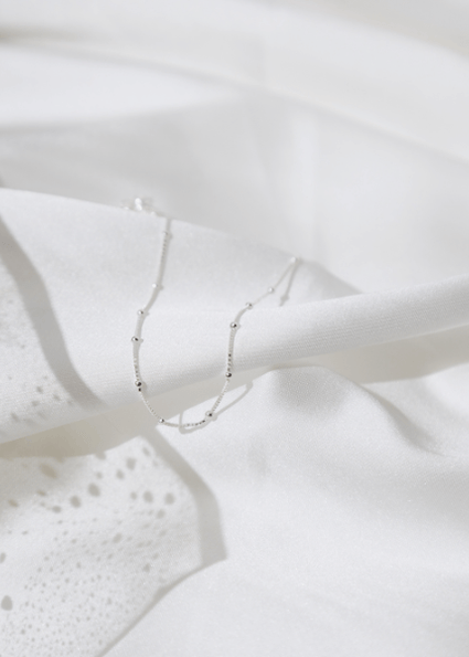 Waterproof Modern Dotted Necklace on white sheet