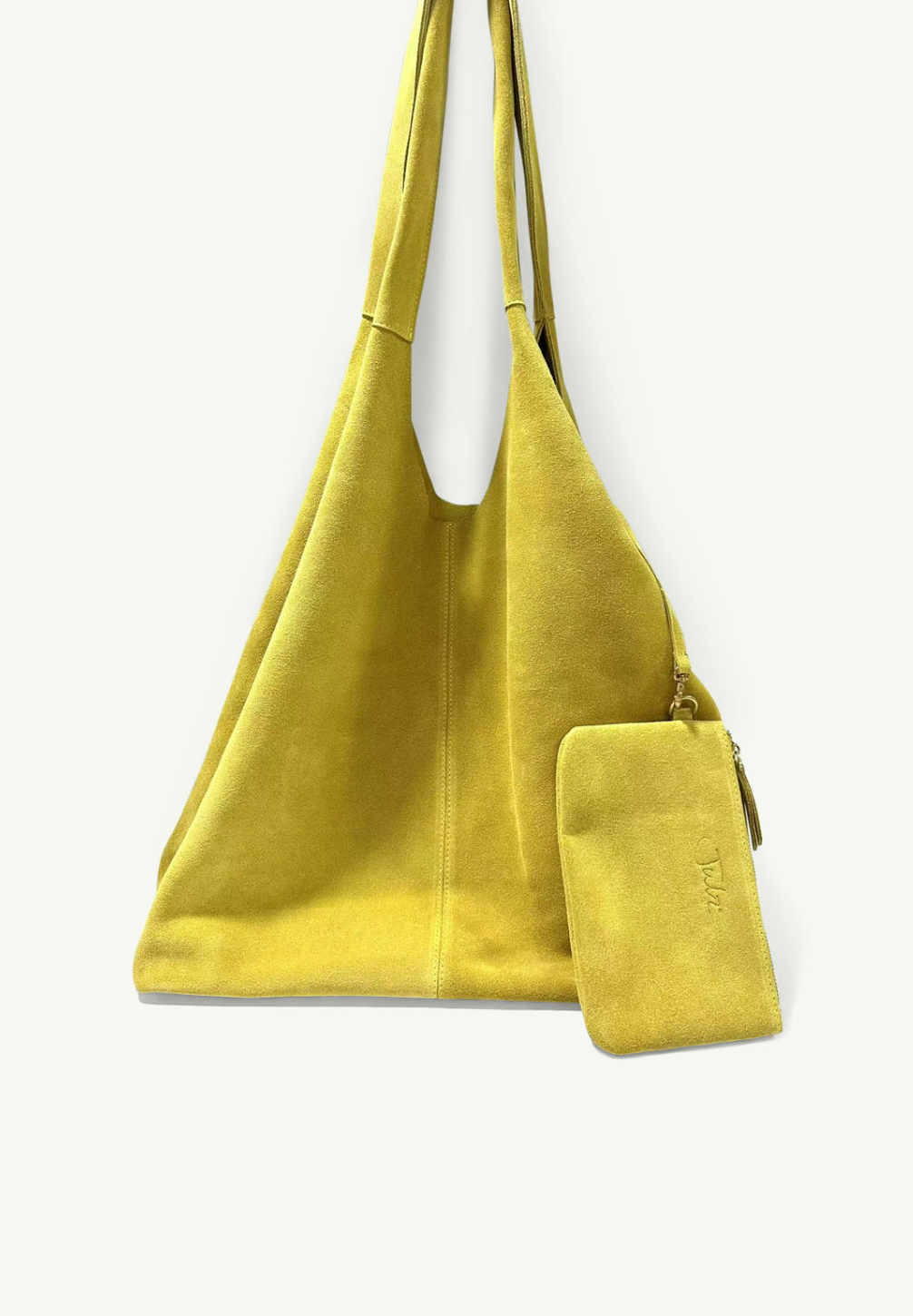 Yellow suede handbag with a matching pouch on a white background