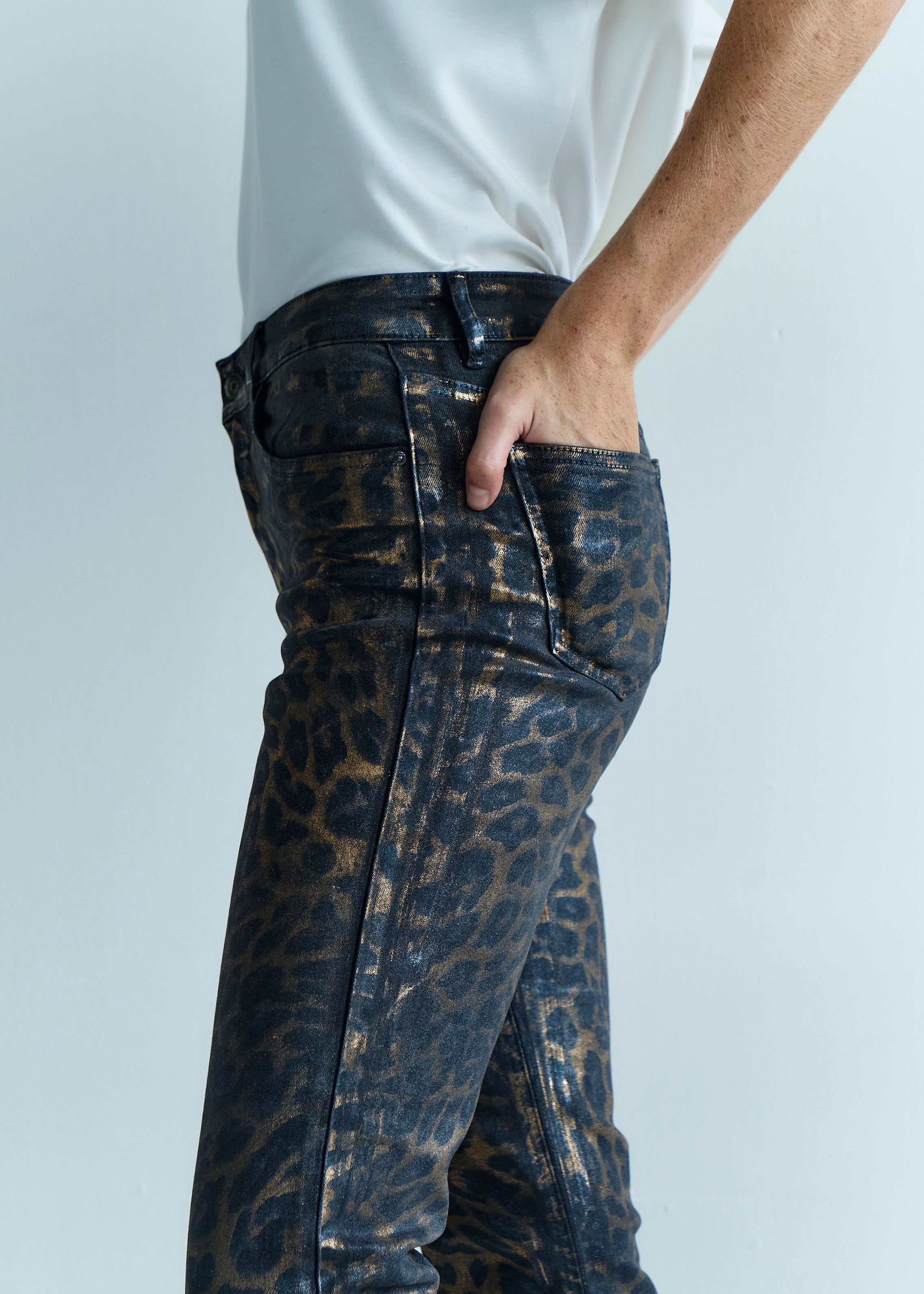 Coated Leopard Print Jeans In Black And Gold