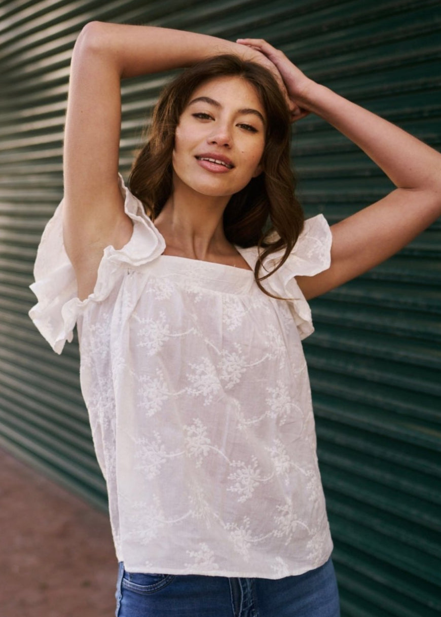 View our Cotton Frill Sleeved Blouse with Floral Embroidery in White - The ultimate TOPS created by TRIBUTE and sold here, at Tribute Store