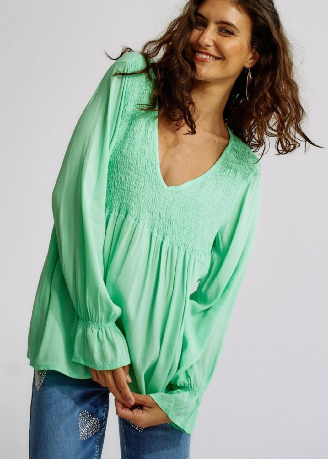 View our Italian Smock V Neck Blouse in Green - The ultimate TOPS created by TRIBUTE and sold here, at Tribute Store