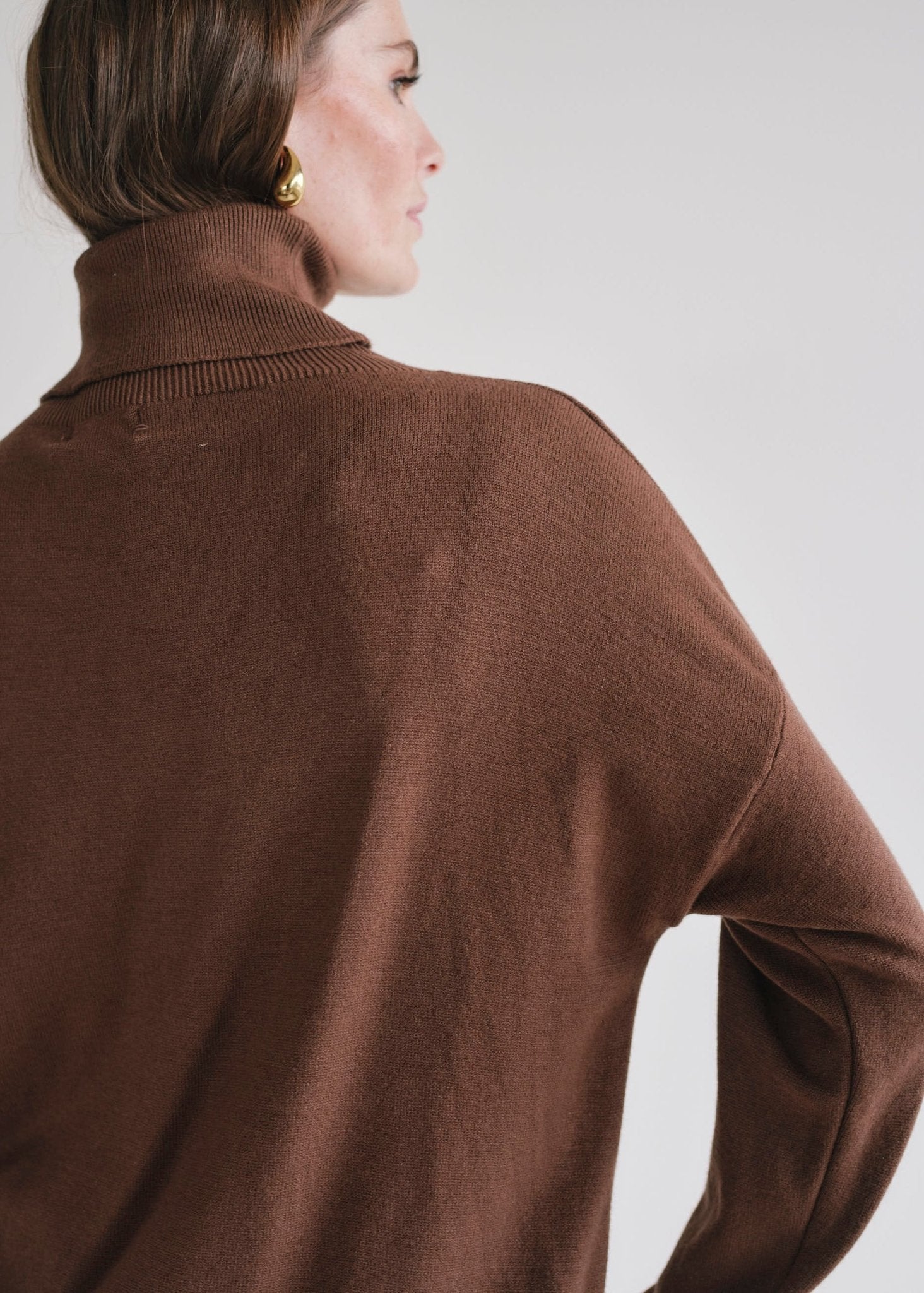View our Bastille Chocolate Polo Neck Knit with Star front - by Tribute Store