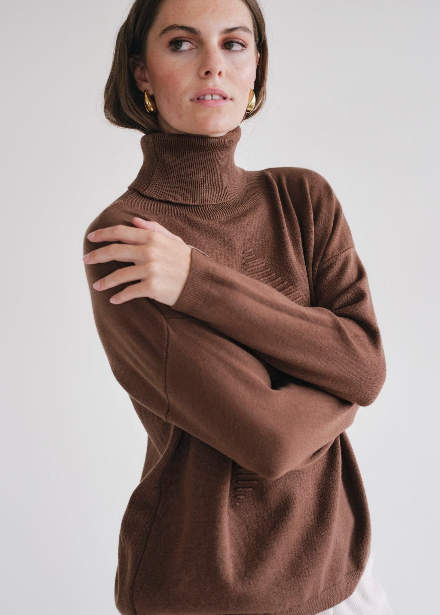 View our Bastille Chocolate Polo Neck Knit with Star front - by Tribute Store