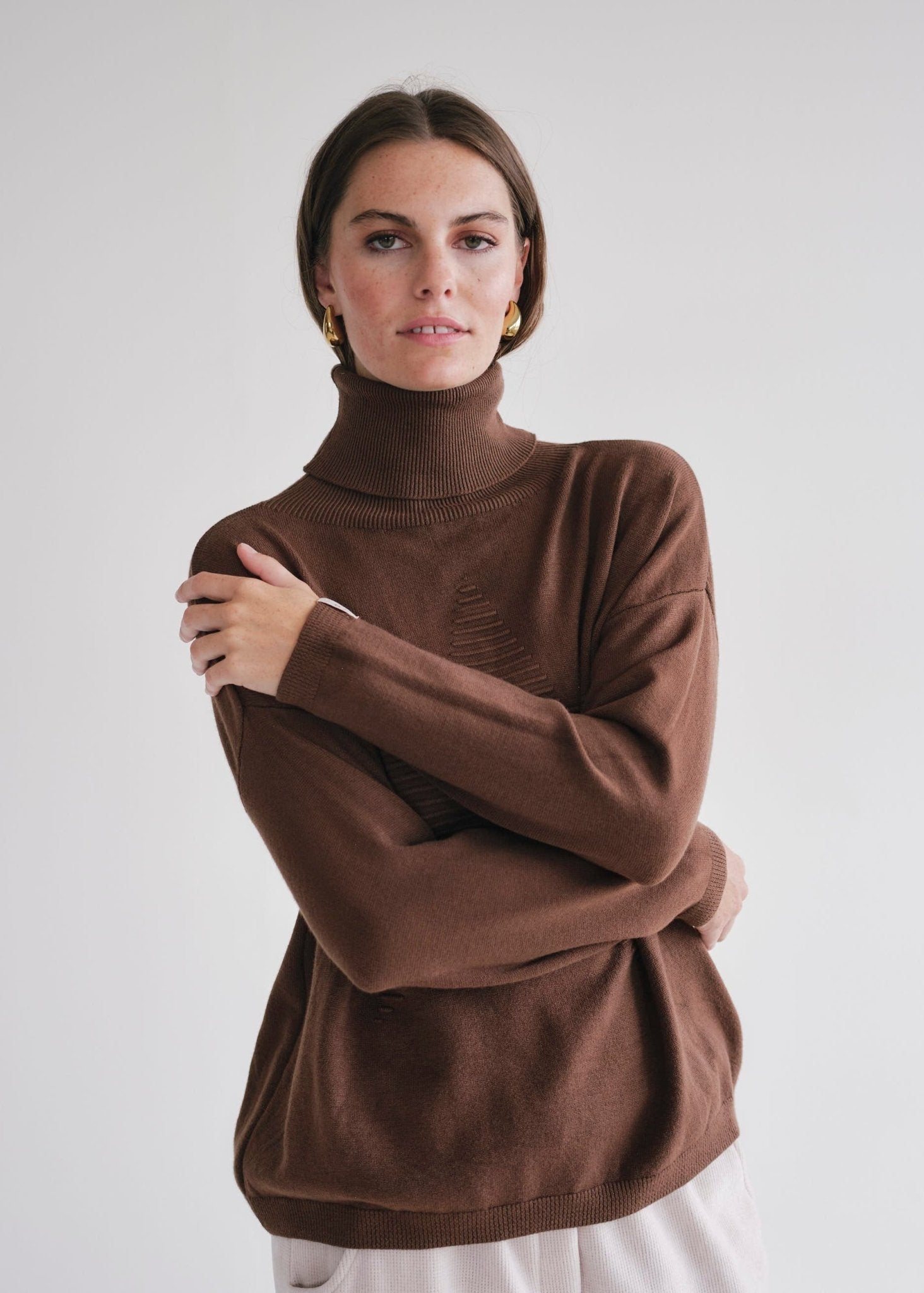 View our Bastille Chocolate Polo Neck Knit with Star front - by Tribute Store