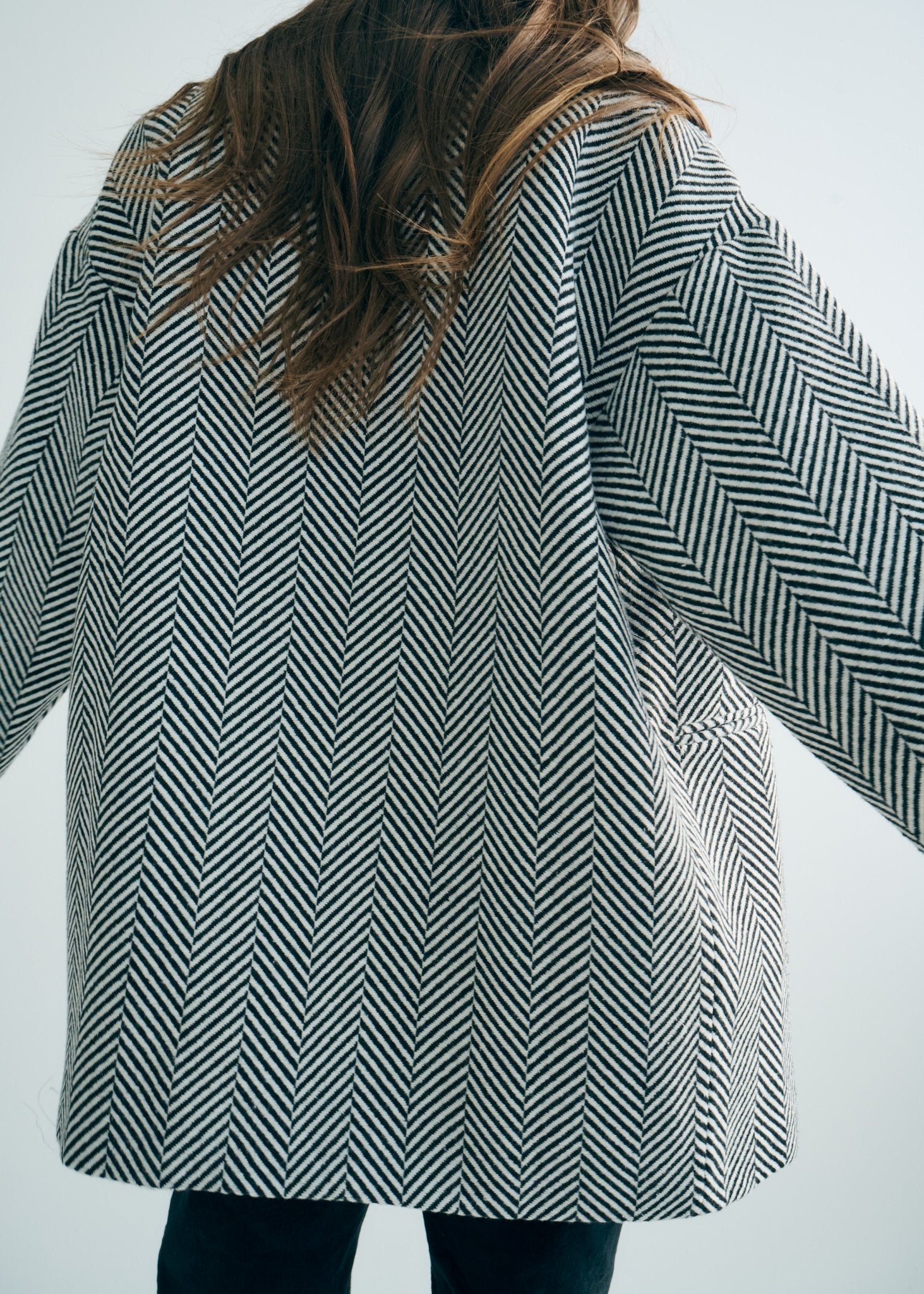 View our Bordeaux Wool Coat in Black and White - by Tribute Store