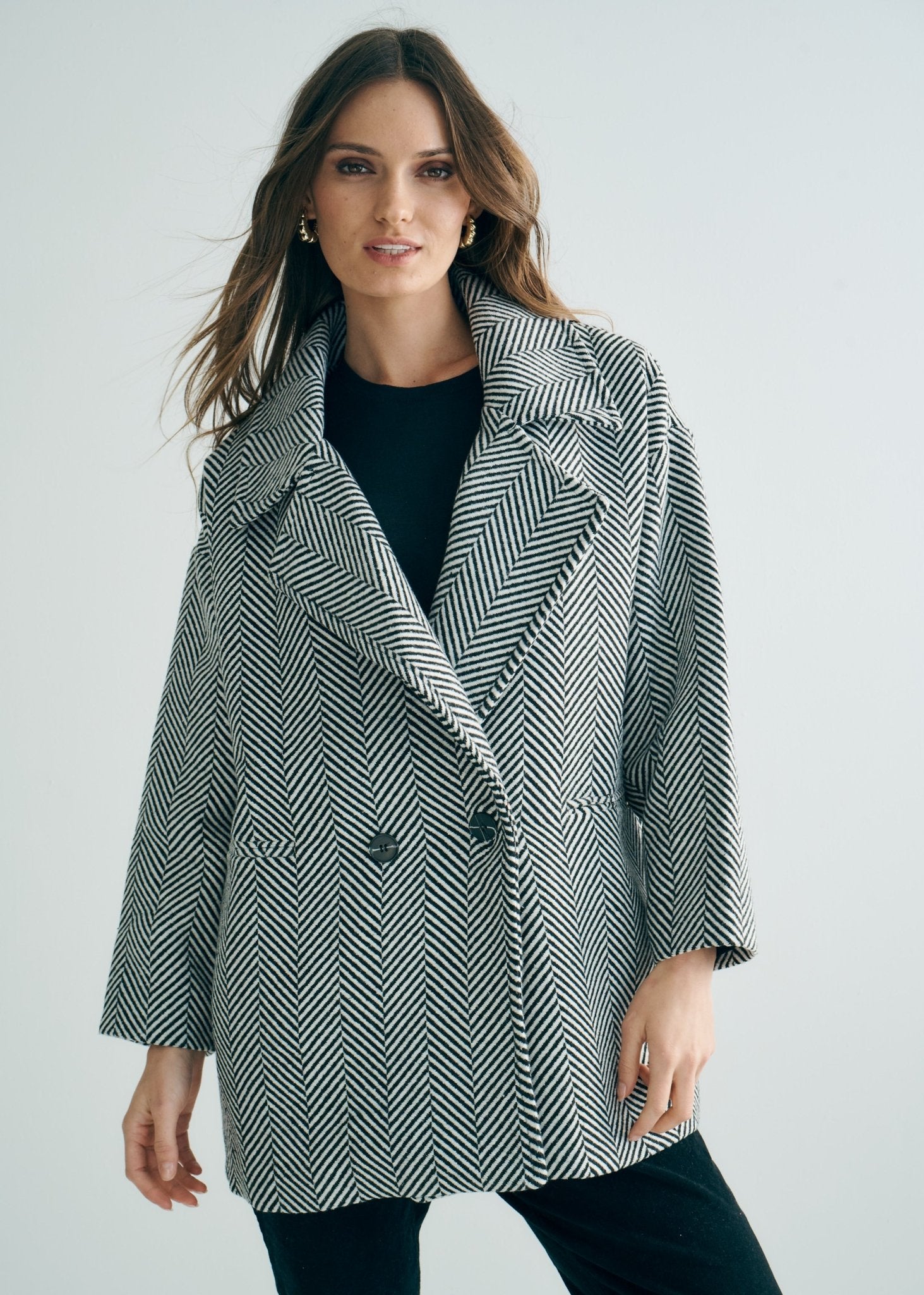 View our Bordeaux Wool Coat in Black and White - by Tribute Store