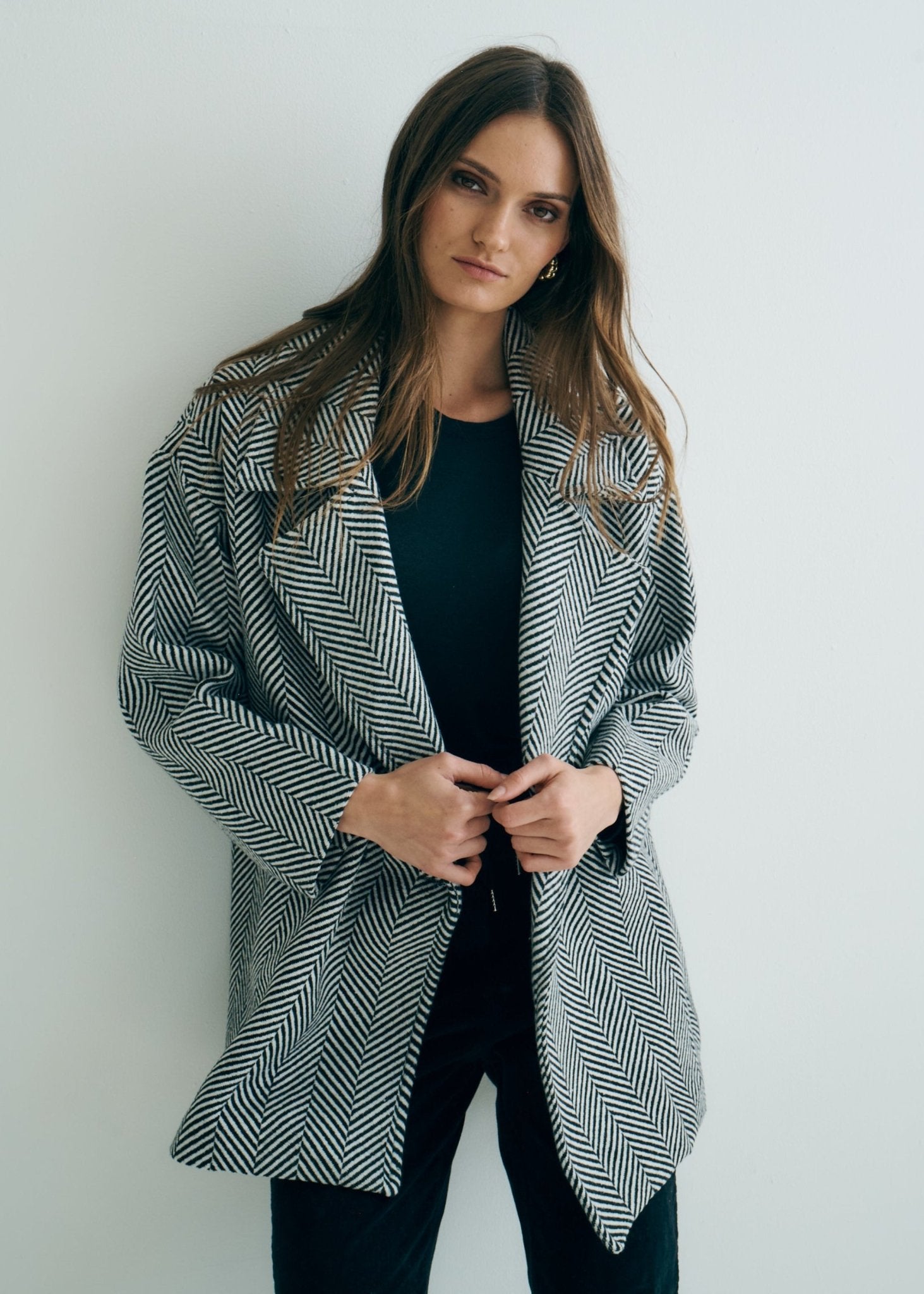 View our Bordeaux Wool Coat in Black and White - by Tribute Store