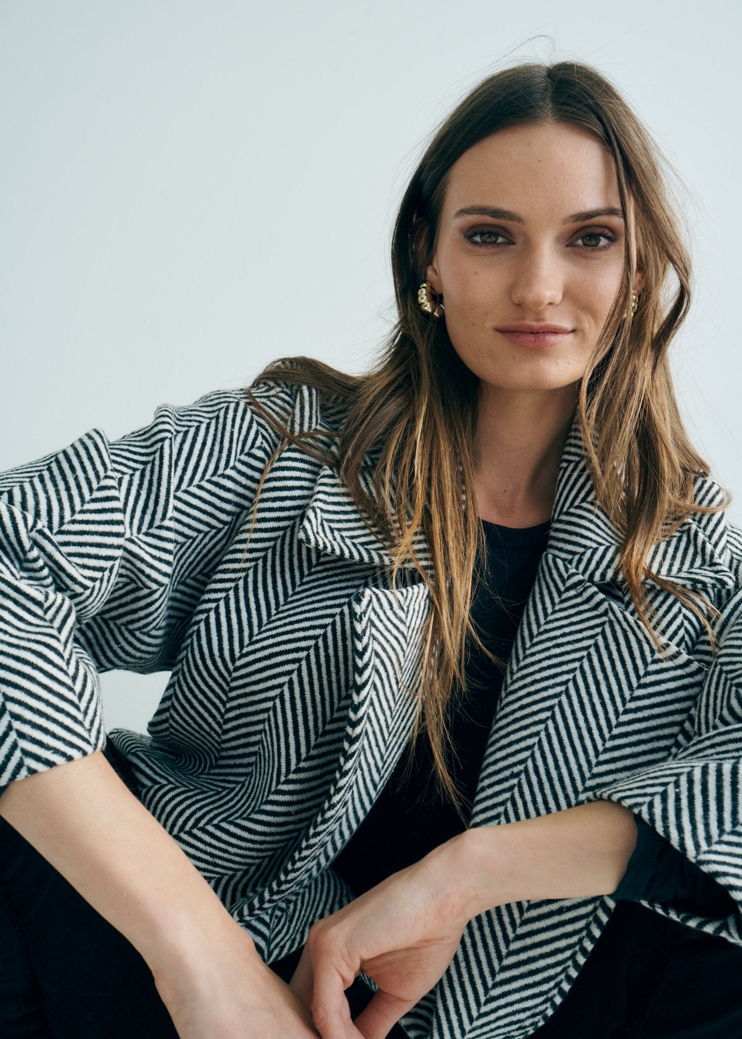 View our Bordeaux Wool Coat in Black and White - by Tribute Store