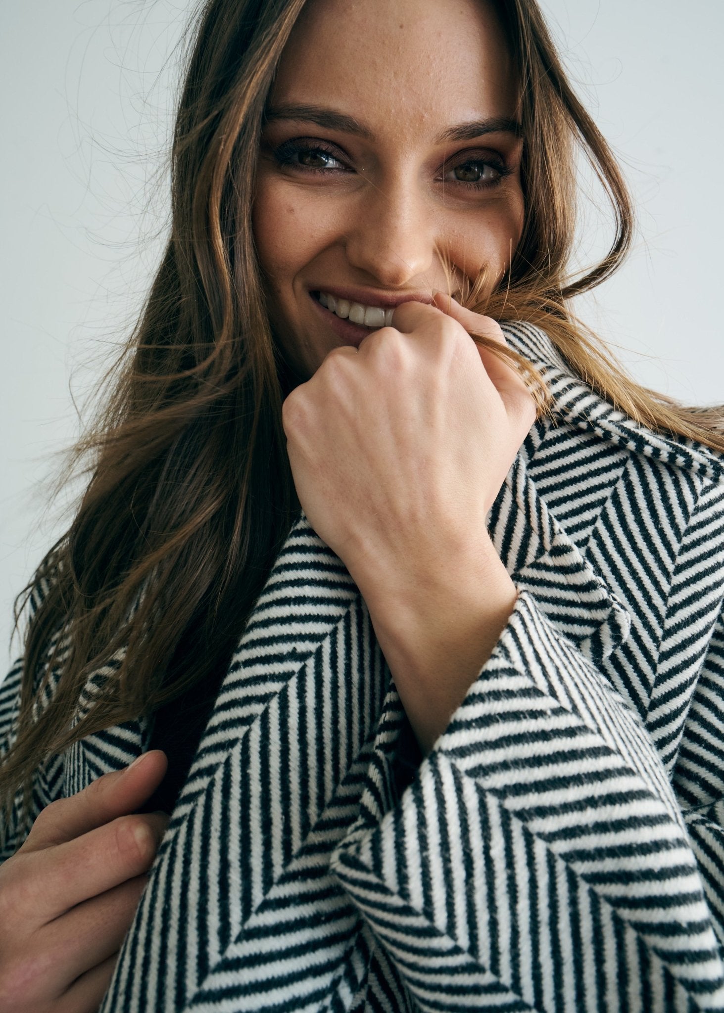 View our Bordeaux Wool Coat in Black and White - by Tribute Store