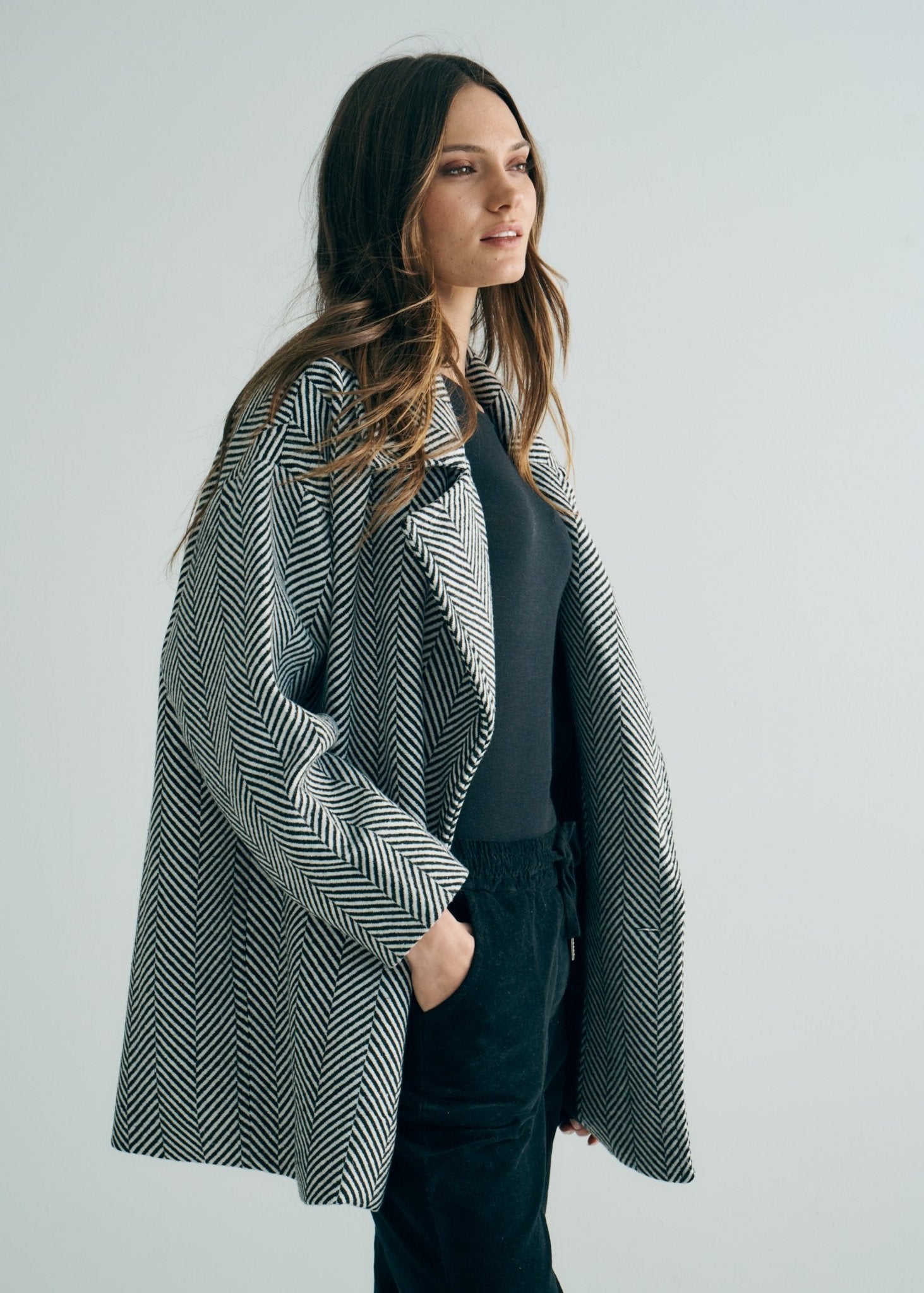 View our Bordeaux Wool Coat in Black and White - by Tribute Store