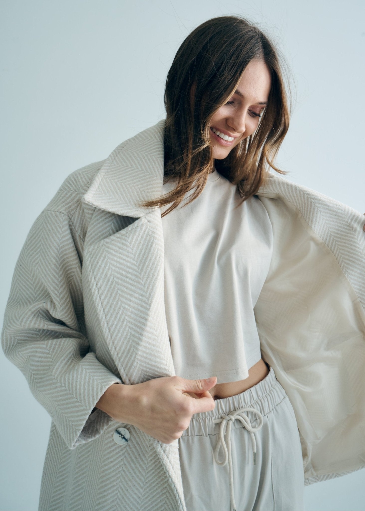 View our Bordeaux Wool Coat in Cream and White - by Tribute Store