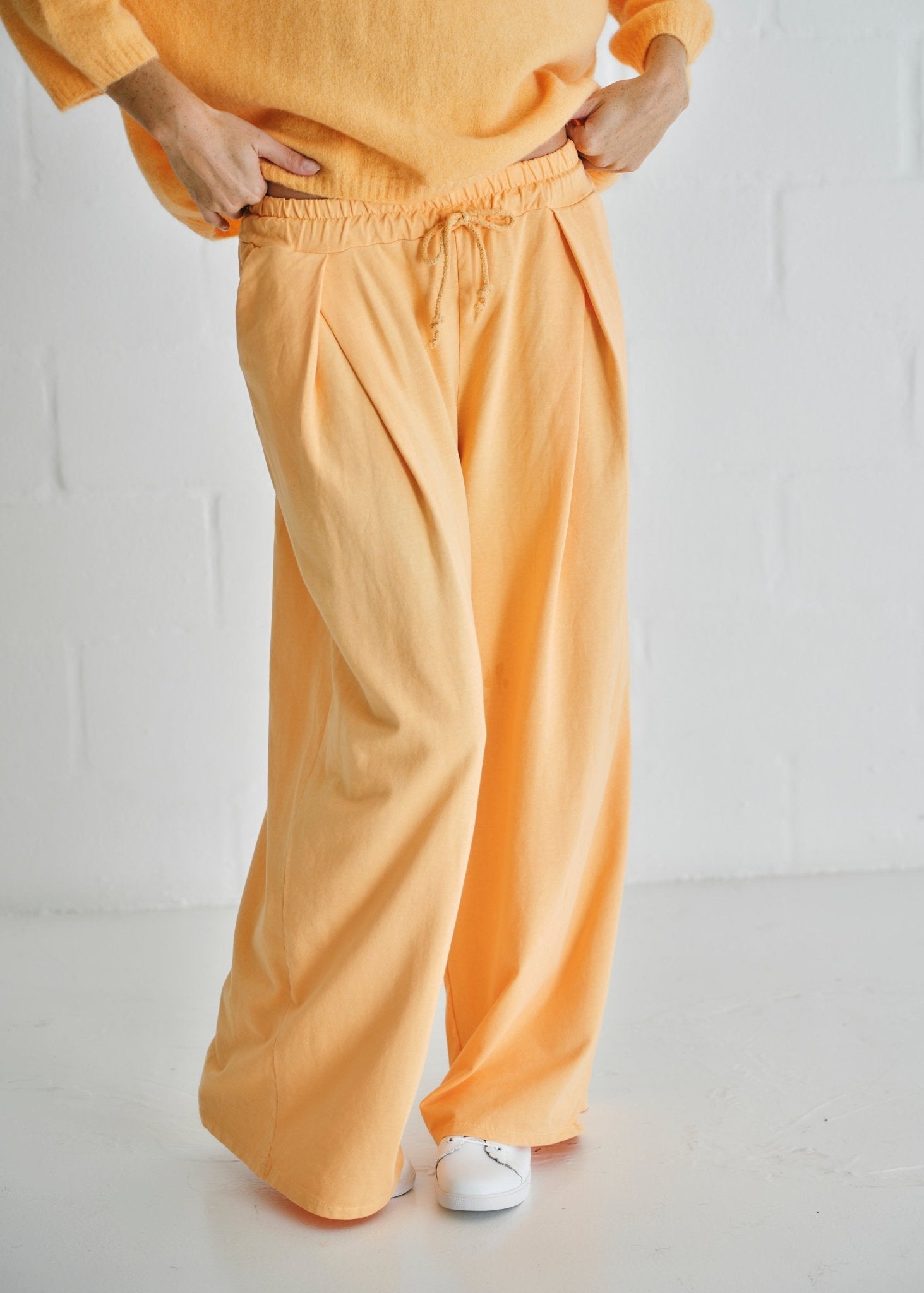 View our Calabria Italian Wide Leg Tracksuit Pants In Apricot - by Tribute Store
