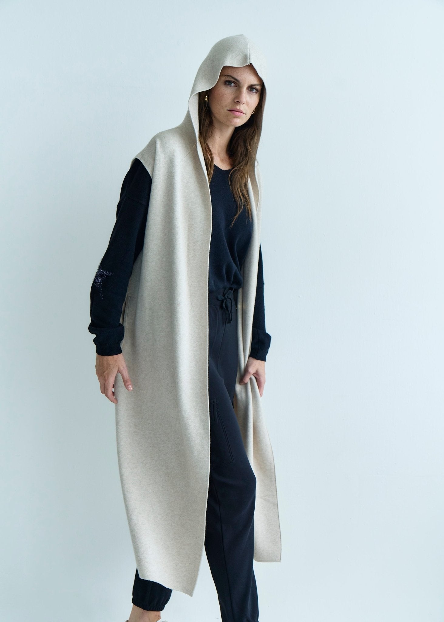 View our Camille Sleeveless Knitted Viscose Coat in Cream - by Tribute Store