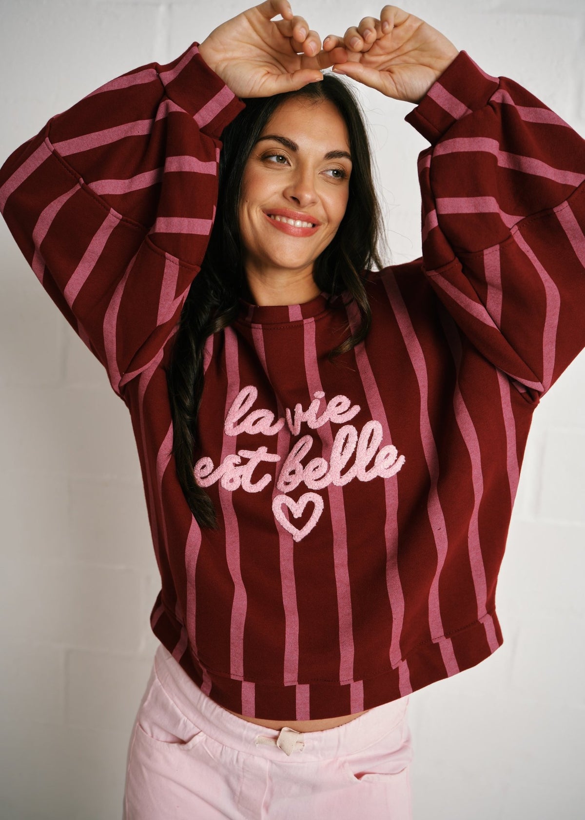 View our Cannes La Vie Est Belle Striped Sweatshirt In Burgundy Pink - by Tribute Store