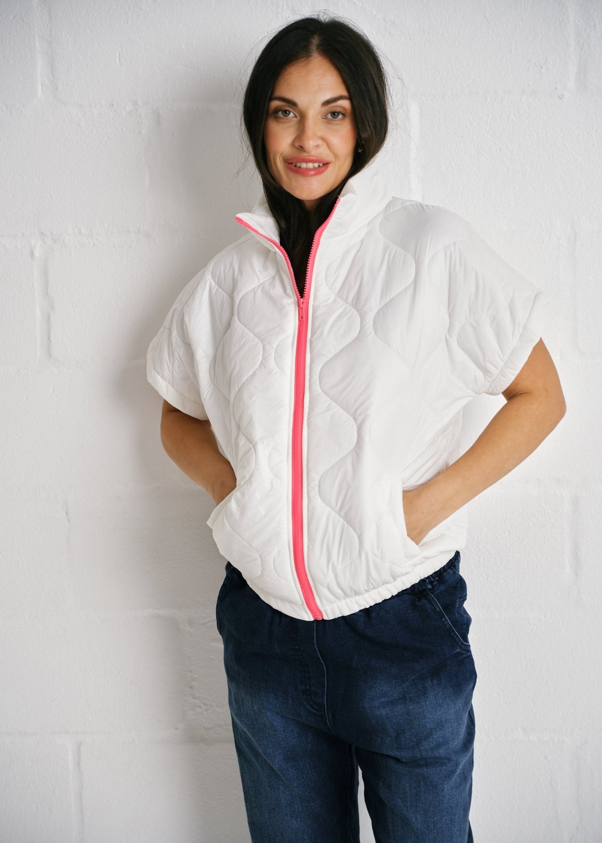 View our Cortina Quilted Short Sleeve Puffer Jacket With Pink Zip In White - by Tribute Store