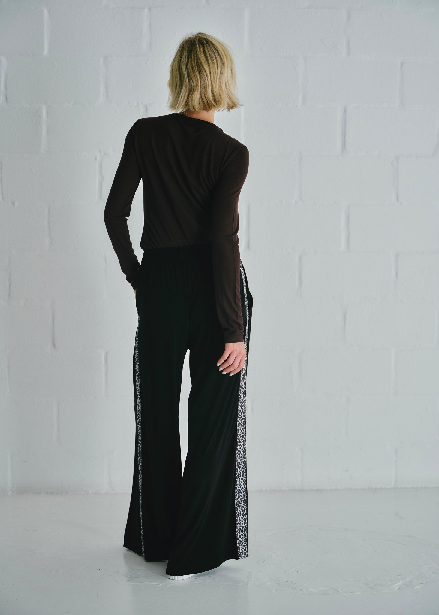 View our Ella Wide Leg Pants In Black With Animal Print - by Tribute Store