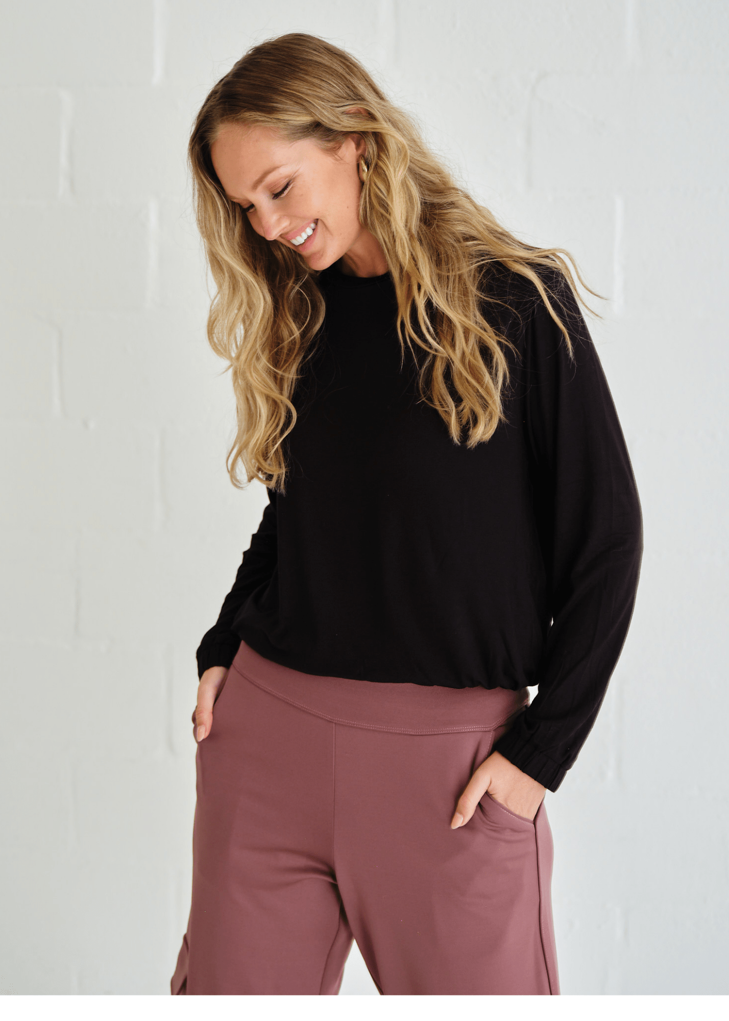 View our Eve Elasticated Hem Top In Black - by Tribute Store