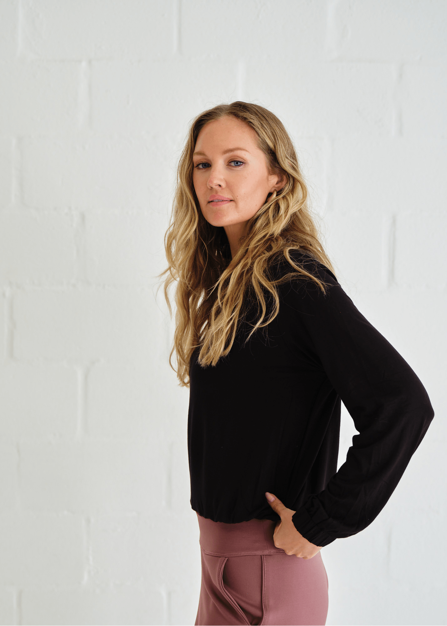 View our Eve Elasticated Hem Top In Black - by Tribute Store