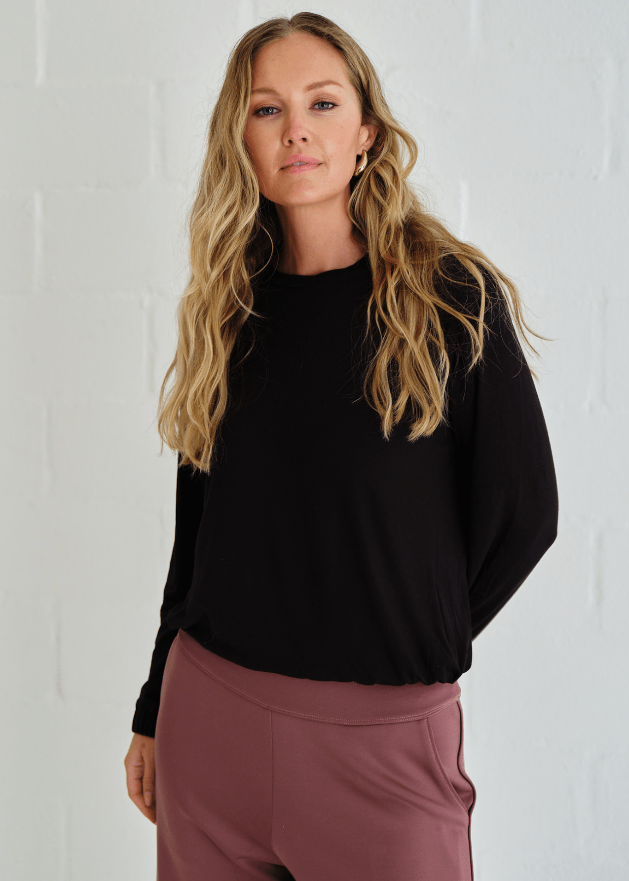 View our Eve Elasticated Hem Top In Black - by Tribute Store