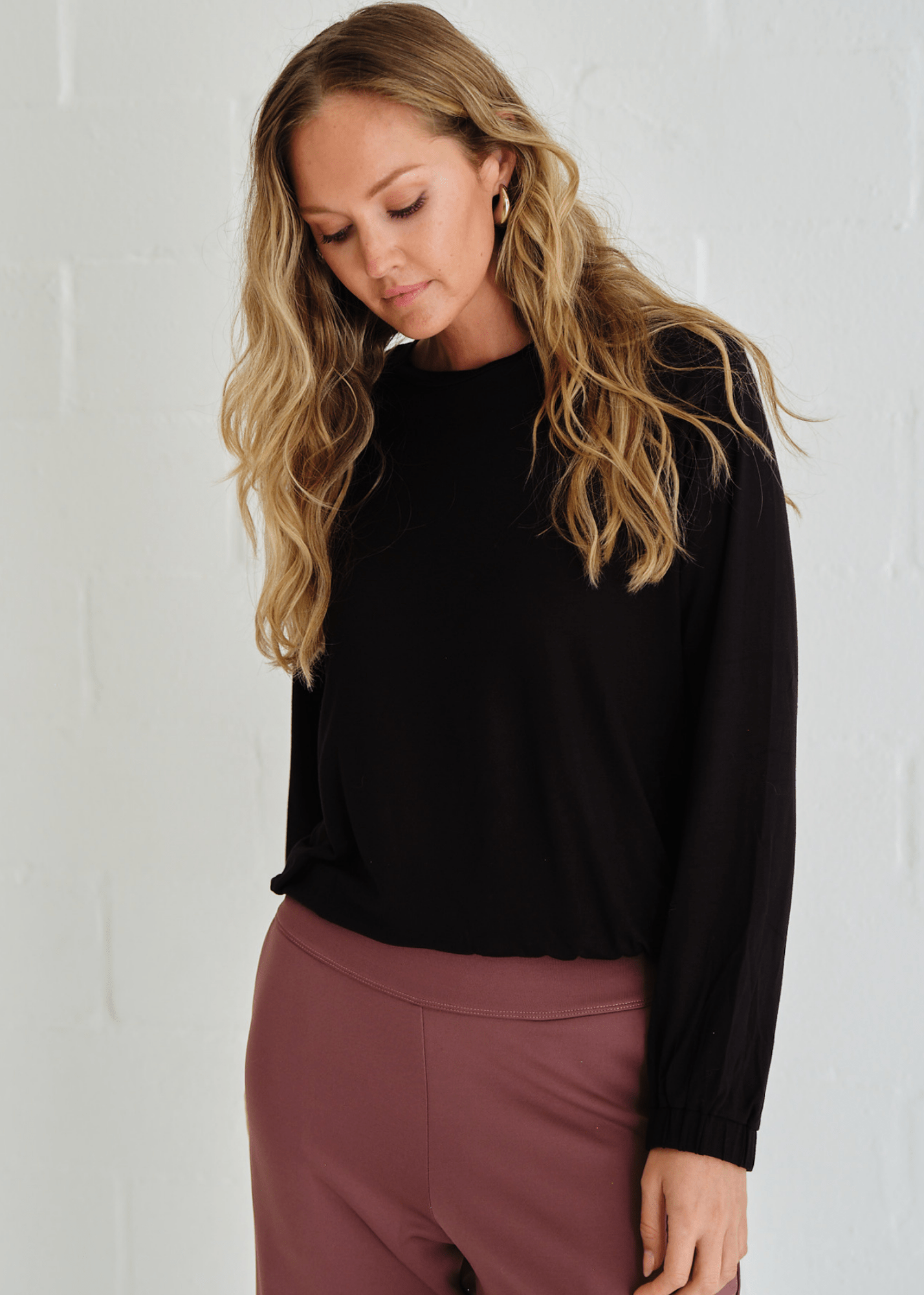View our Eve Elasticated Hem Top In Black - by Tribute Store