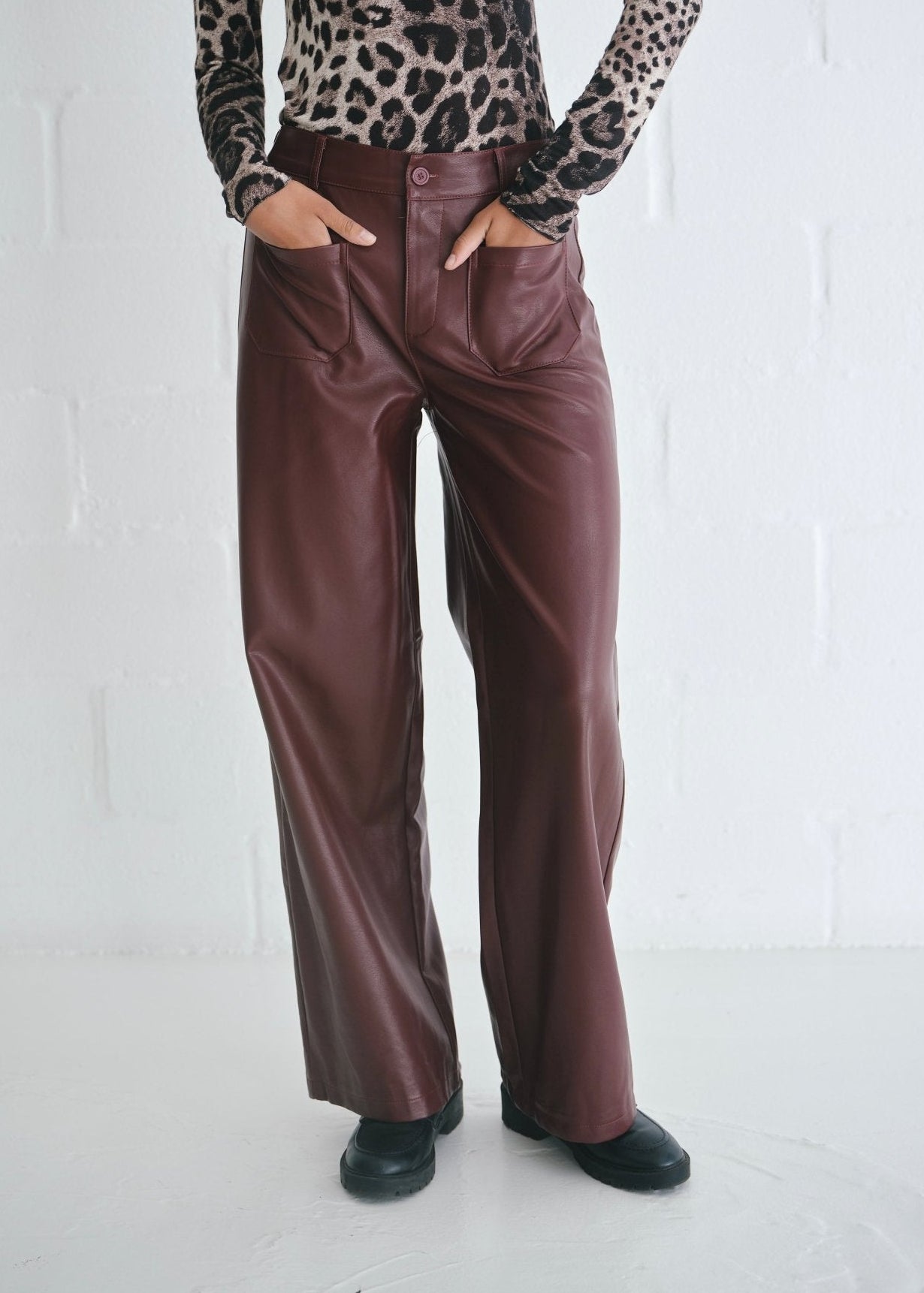 View our Faux Leather Wide Leg Trousers In Burgundy - by Tribute Store