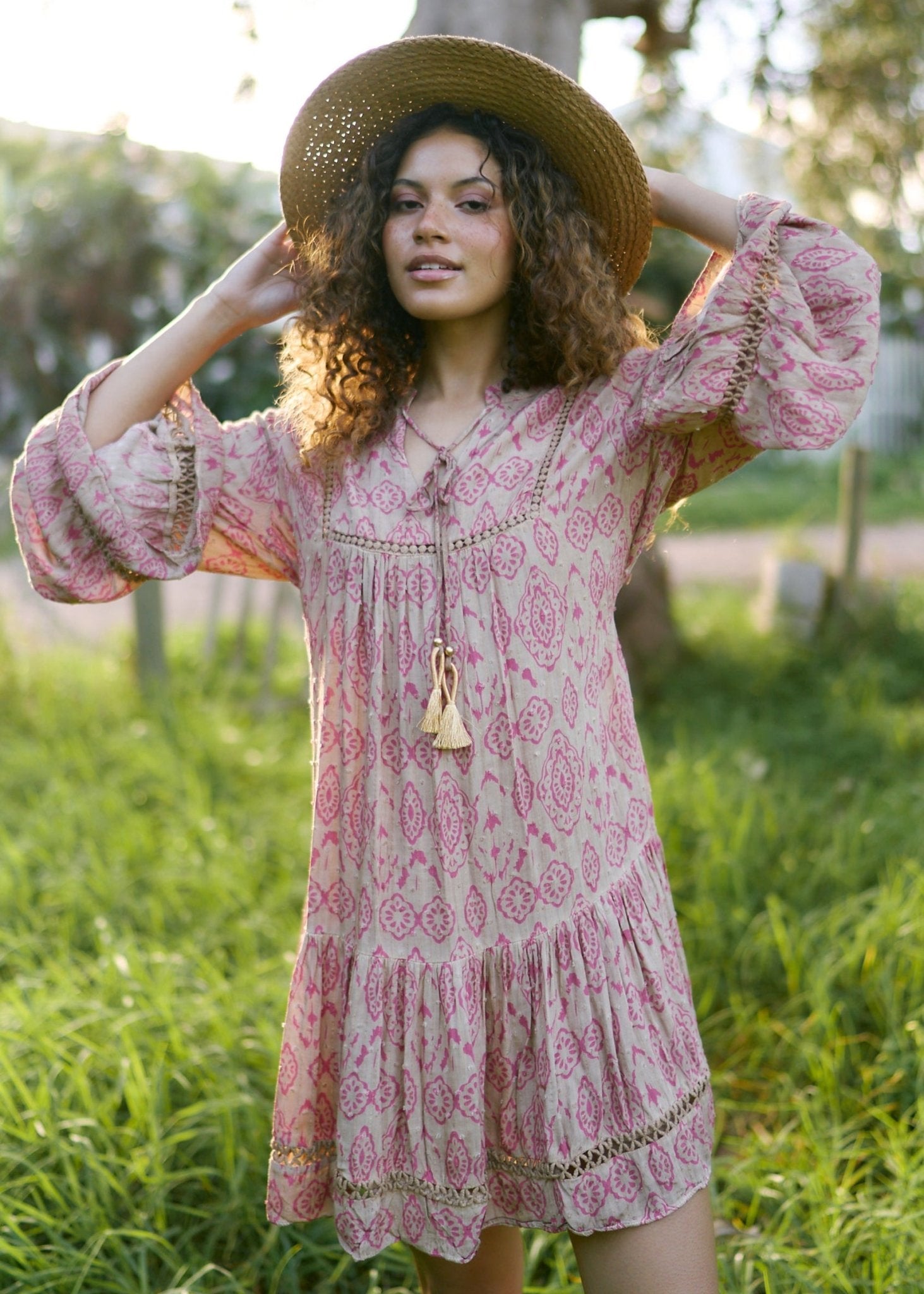 View our Helena Short Bohemian Dress with Tassels in Pink Print - by Tribute Store