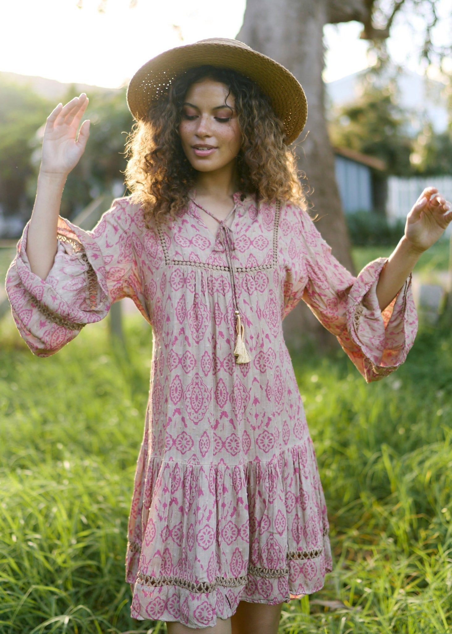 View our Helena Short Bohemian Dress with Tassels in Pink Print - by Tribute Store