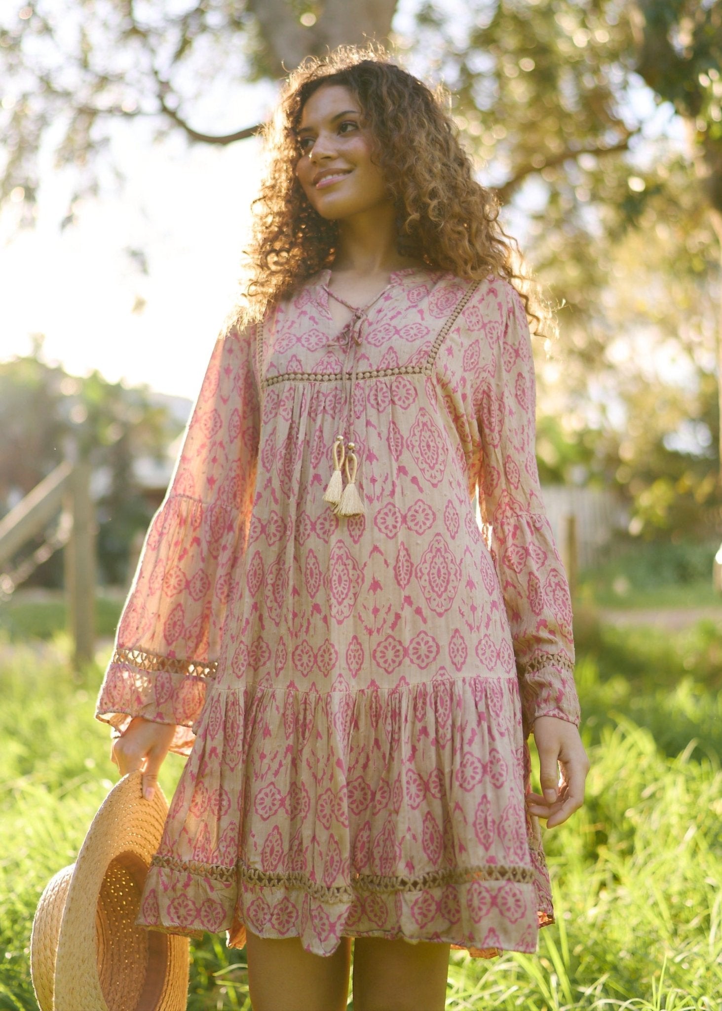View our Helena Short Bohemian Dress with Tassels in Pink Print - by Tribute Store