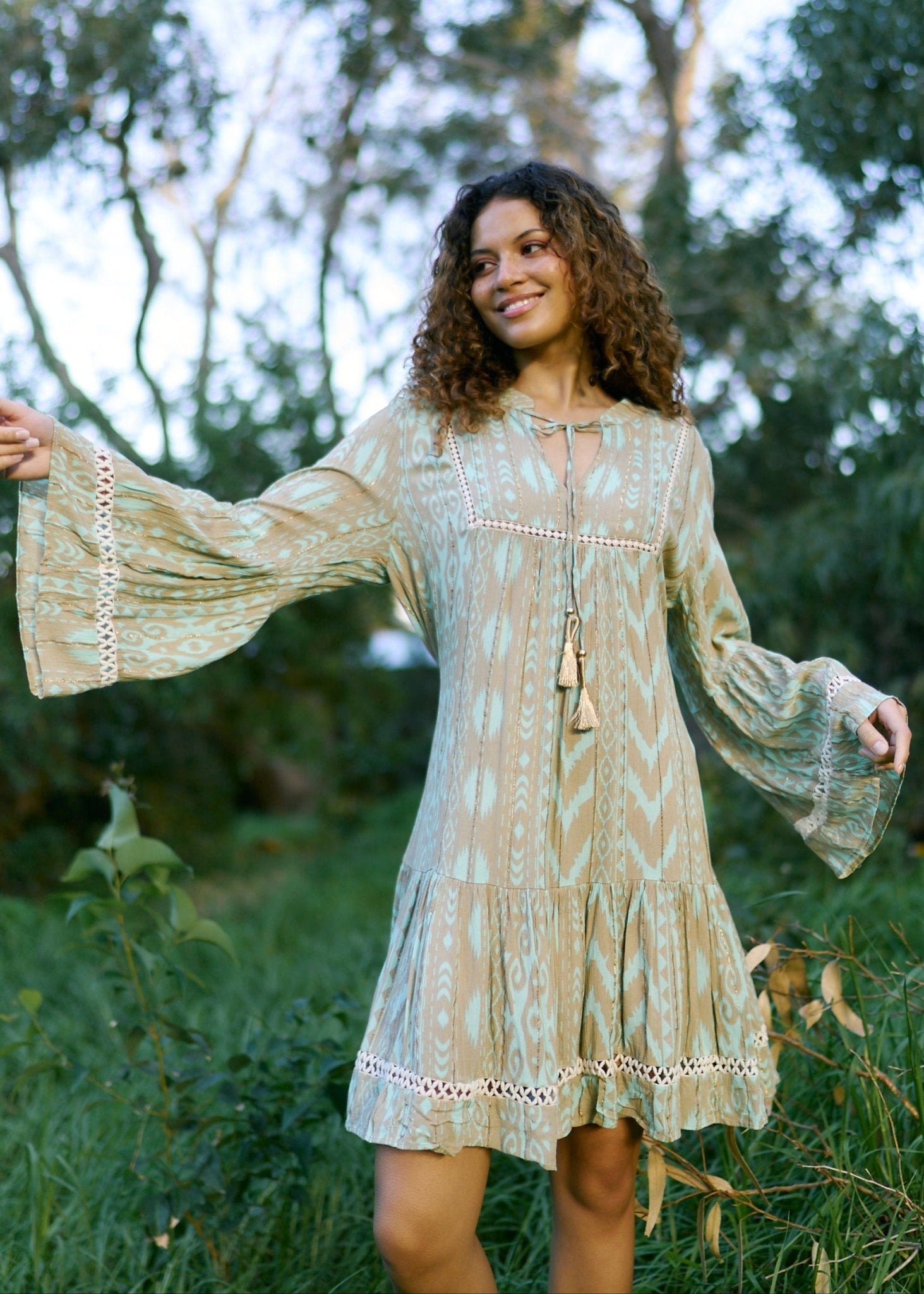 View our Helena Short Bohemian Dress with Tassels in Seagreen - by Tribute Store