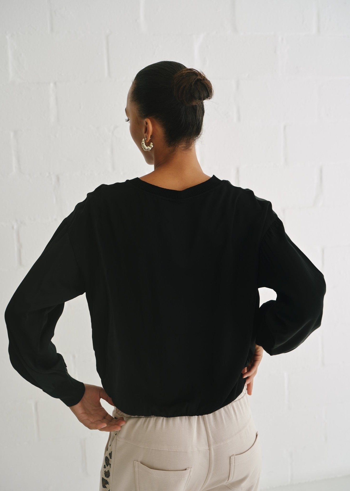 View our Italian Crew Neck Satin Long Sleeved Top In Black - by Tribute Store