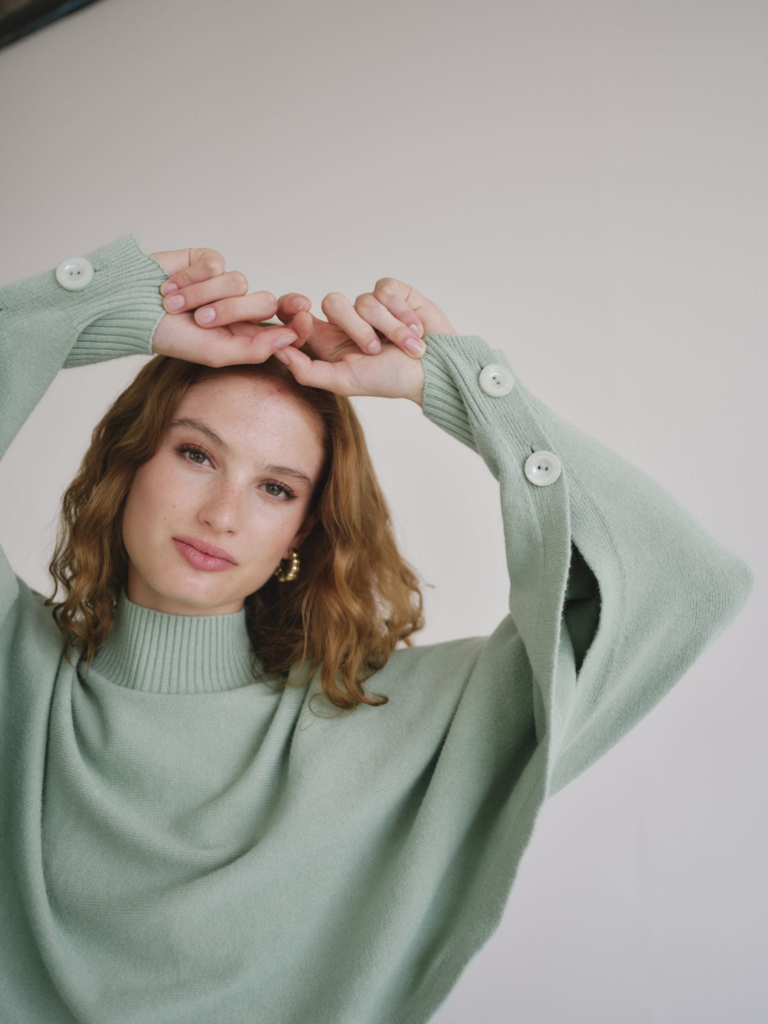 View our Italian Cropped Batwing Knit in Seafoam Green - by Tribute Store