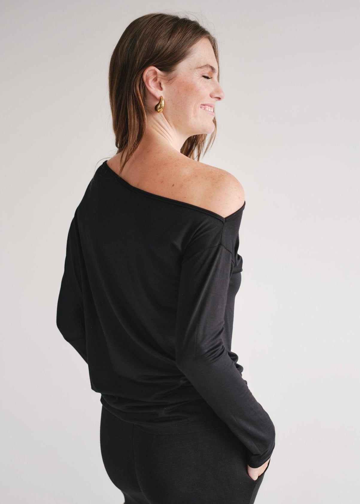 View our Long Sleeved Off The Shoulder Classic Top In Black - by Tribute Store