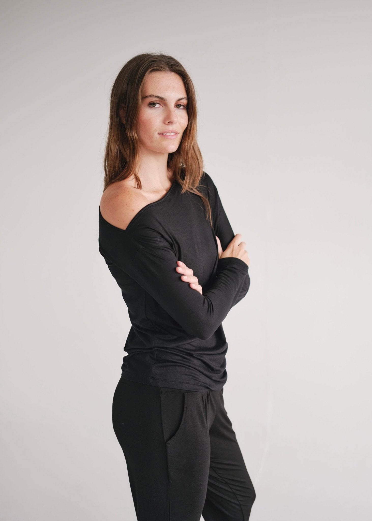 View our Long Sleeved Off The Shoulder Classic Top In Black - by Tribute Store