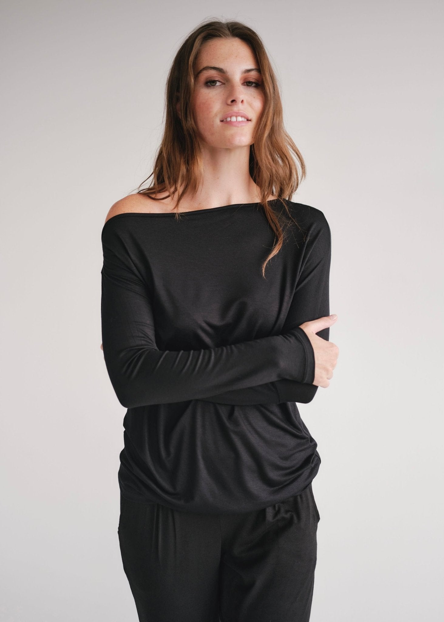 View our Long Sleeved Off The Shoulder Classic Top In Black - by Tribute Store
